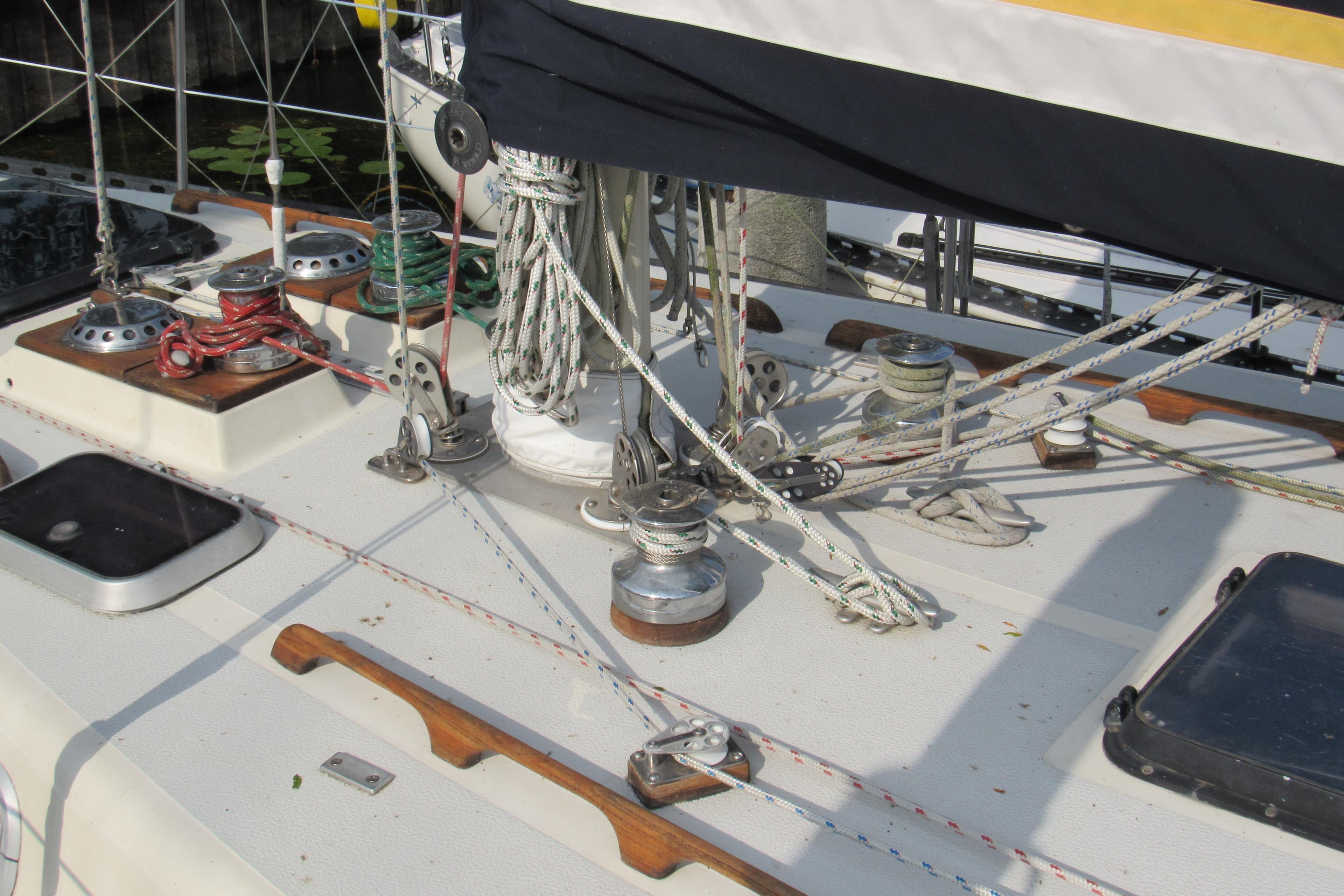 Deck of 1976 Tartan 3800 sailboat with ropes and winches.