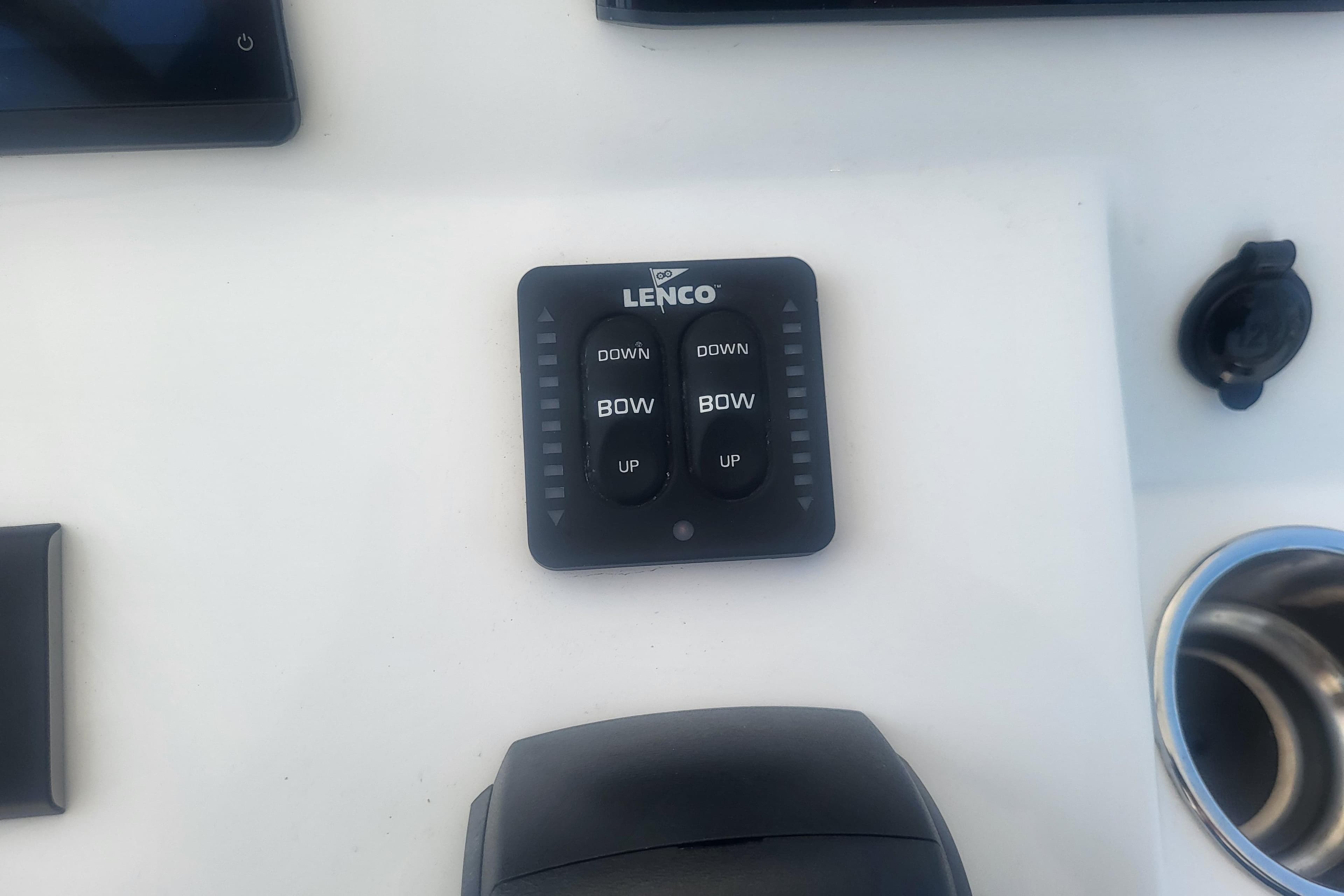 Lenco trim tab control panel on 2022 Edgewater 245CC boat dashboard.