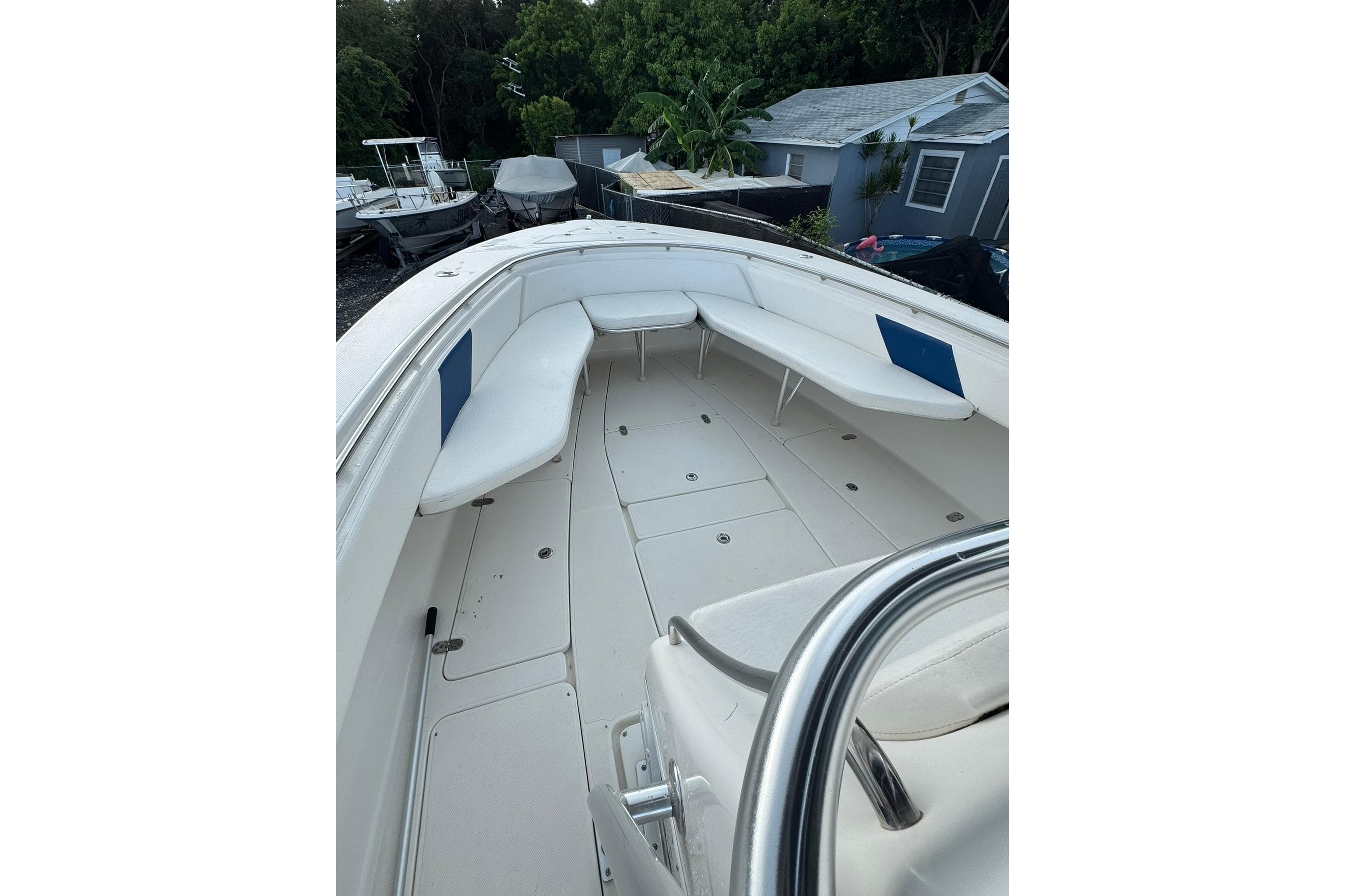 2004 Fountain 34 CC boat interior with white seating and spacious deck.