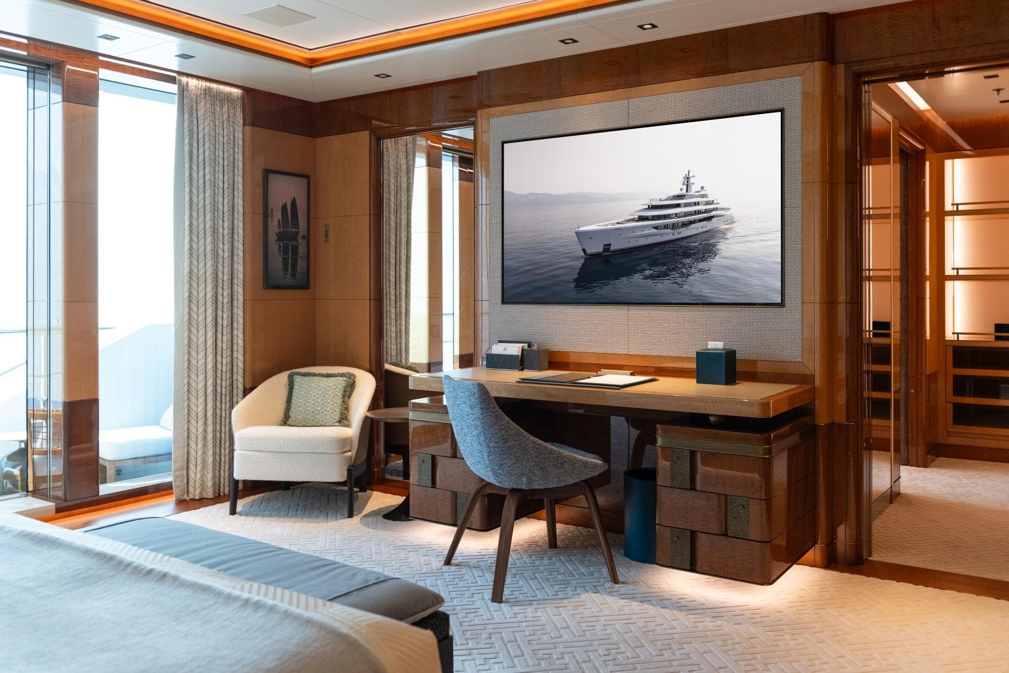 Luxurious interior of 2022 Amels Custom yacht with elegant furnishings and large window views.