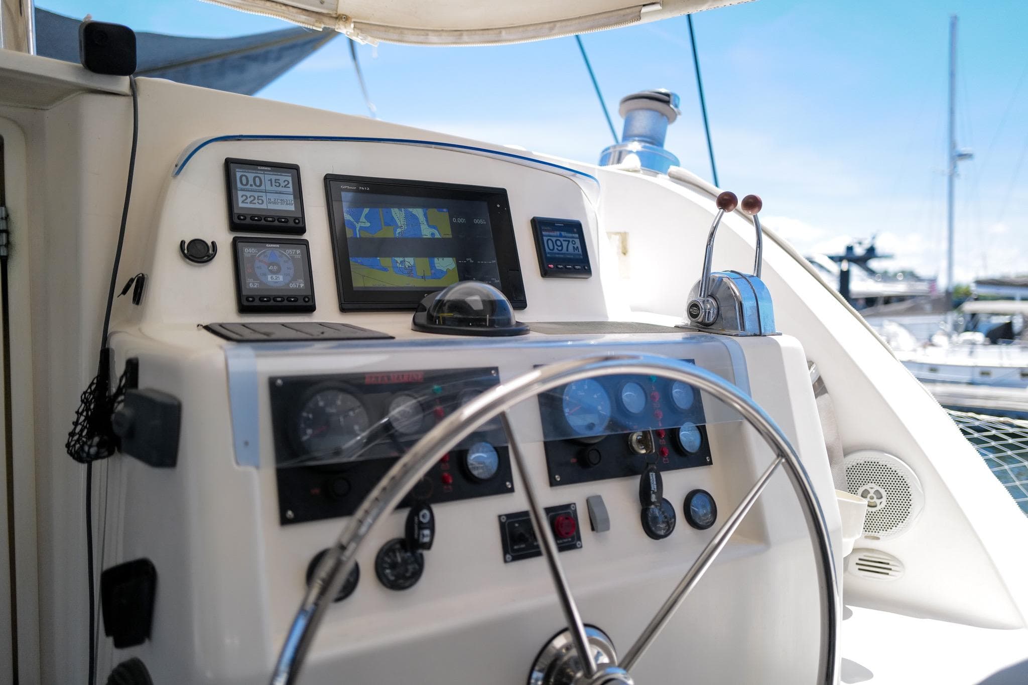 Steering console of a 2006 Leopard 43 yacht with navigation instruments and controls.