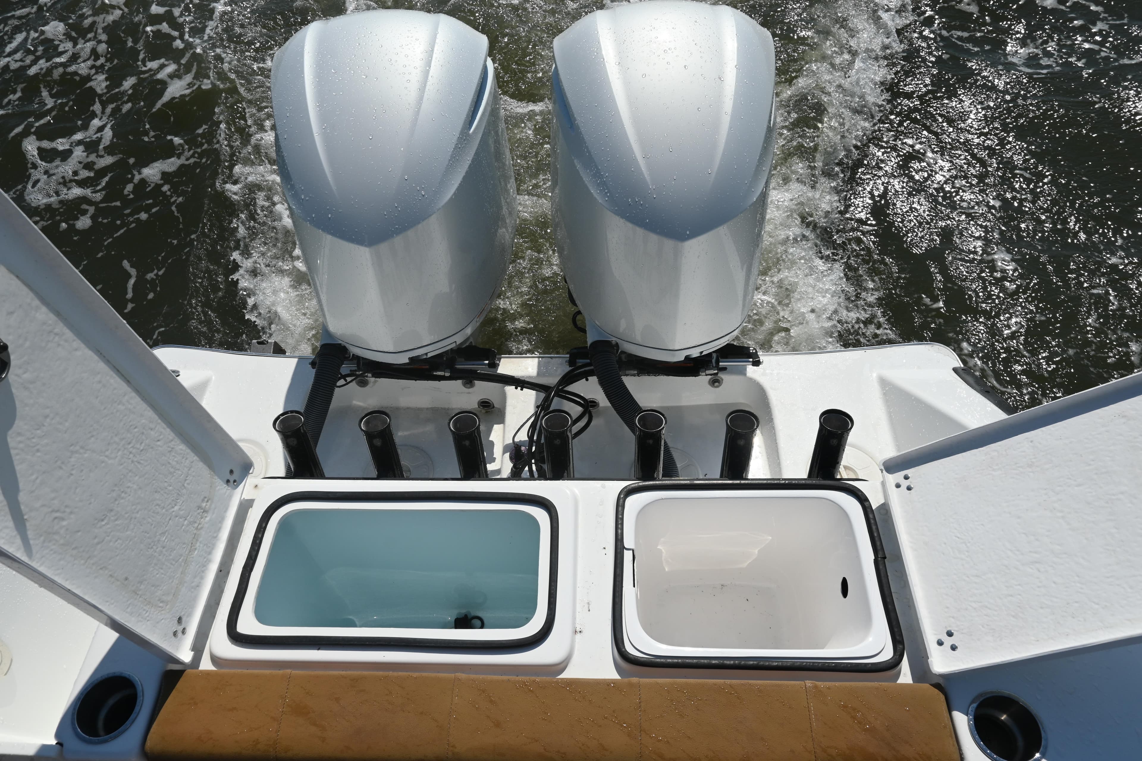 2021 Cape Horn 32 T boat with dual engines and fishing rod holders.
