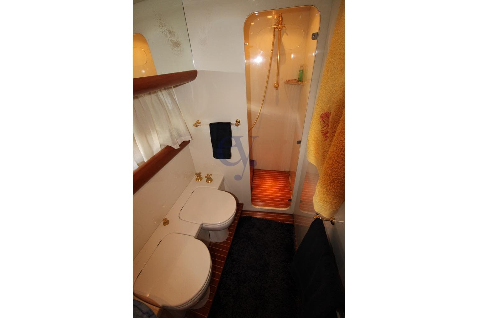 1996 Canados 23 yacht bathroom with shower, toilet, and elegant fixtures.