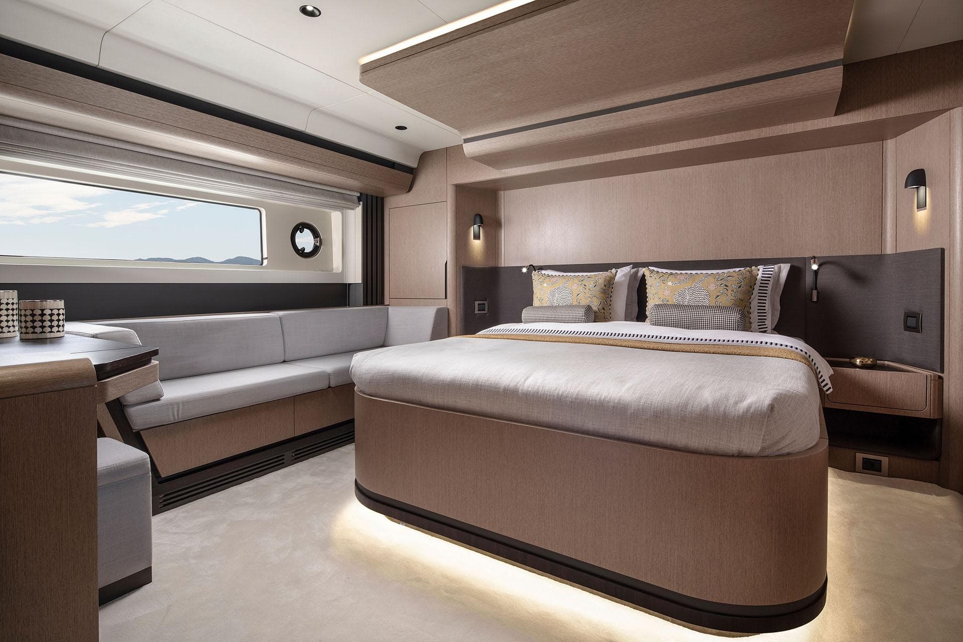 Luxurious interior of 2025 Sirena 48 yacht with elegant bedroom and seating area.