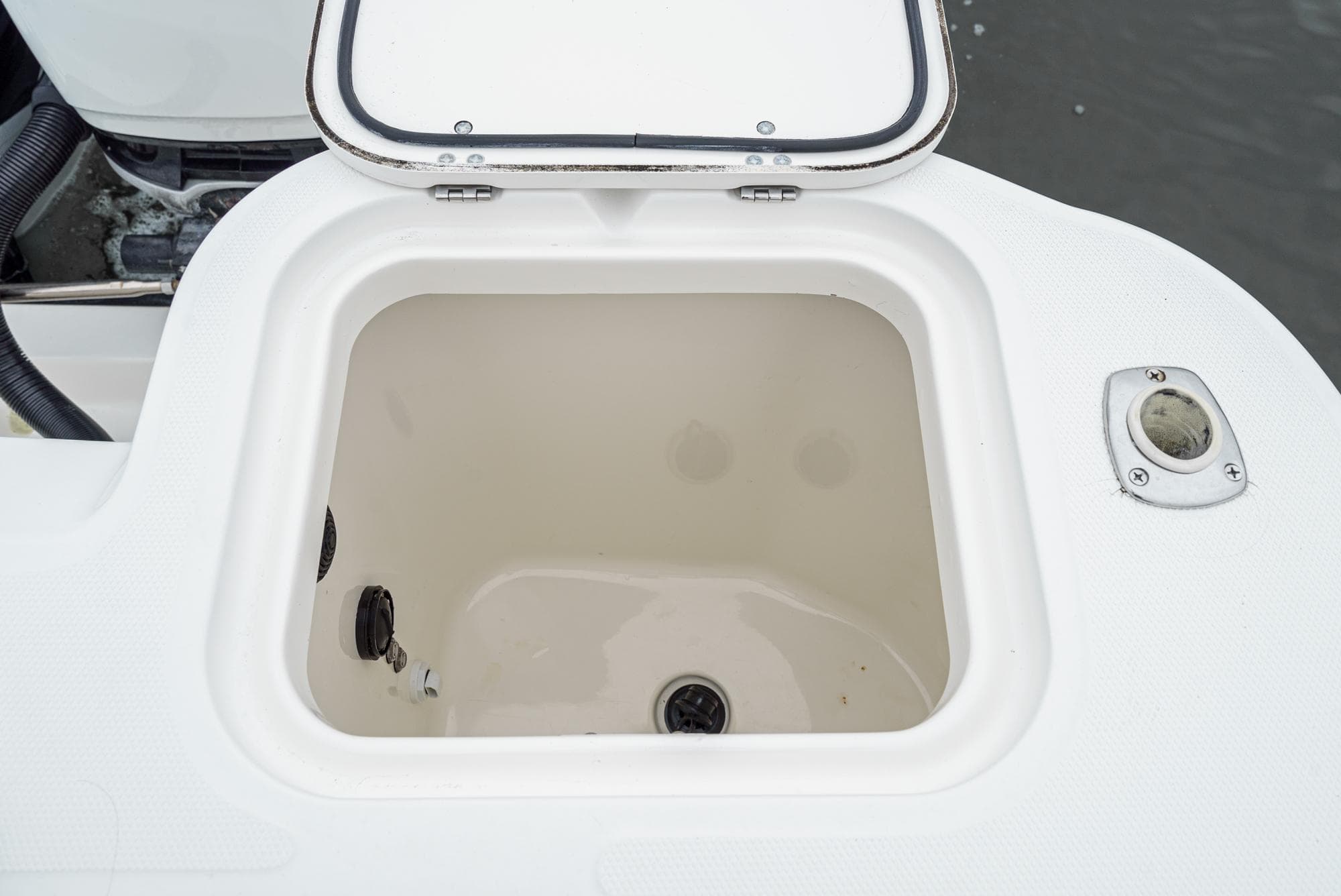 Open storage compartment on a 2008 Boston Whaler 345 Conquest boat.