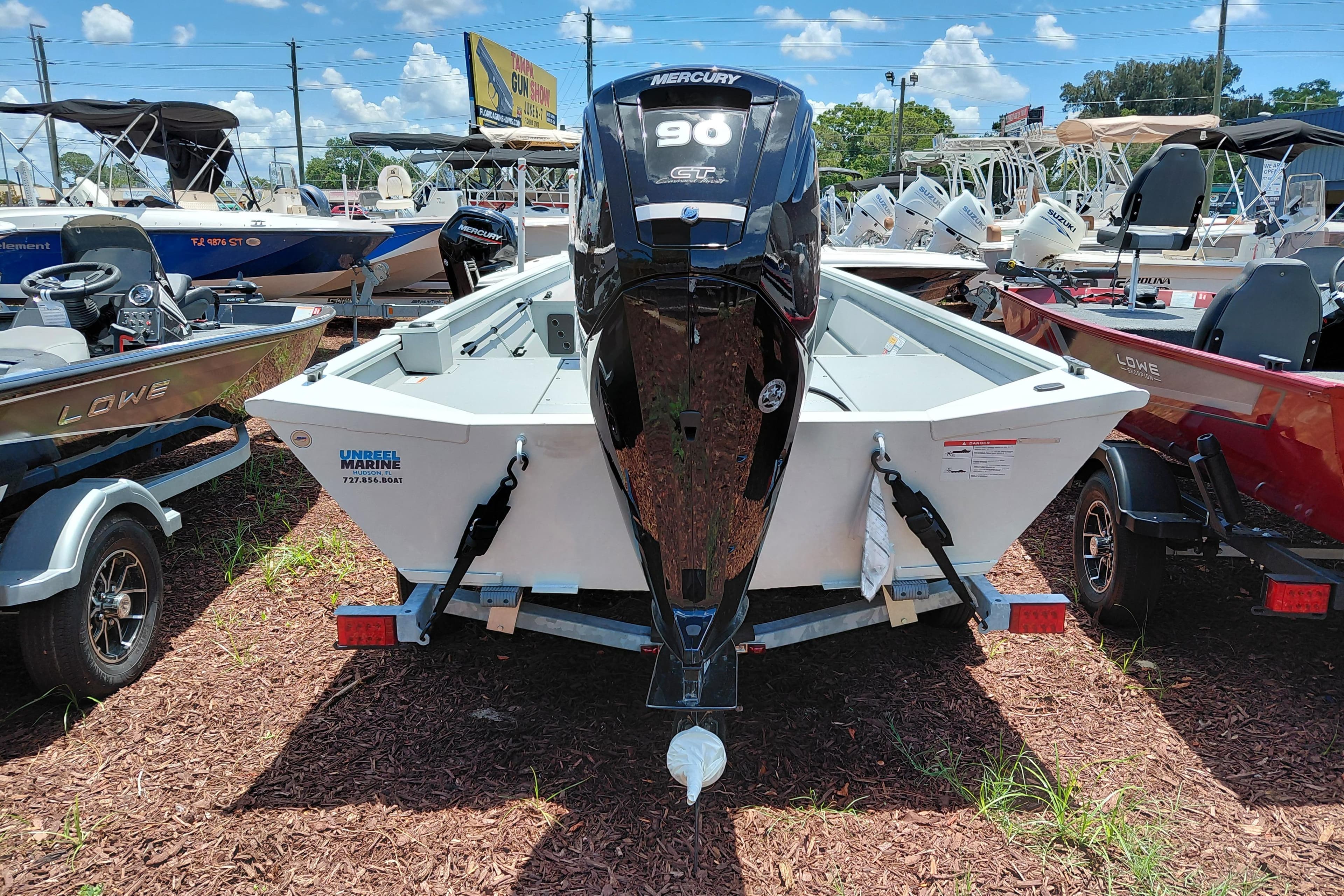 2026 Lowe Roughneck RX1860 CC boat with Mercury 90 engine displayed outdoors.