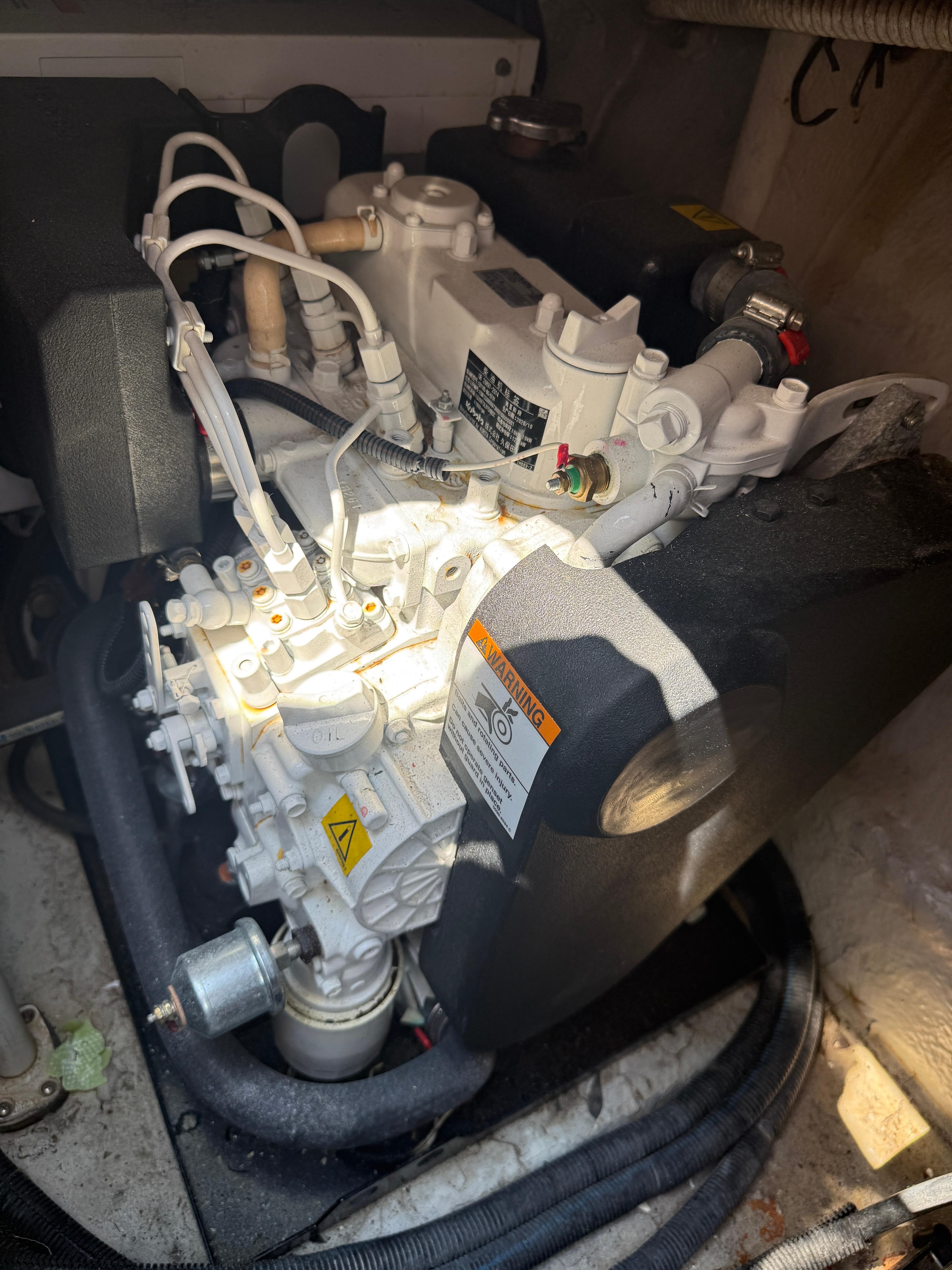 Engine compartment of a 2003 Sea Ray 420 Sundancer boat, showing mechanical components.