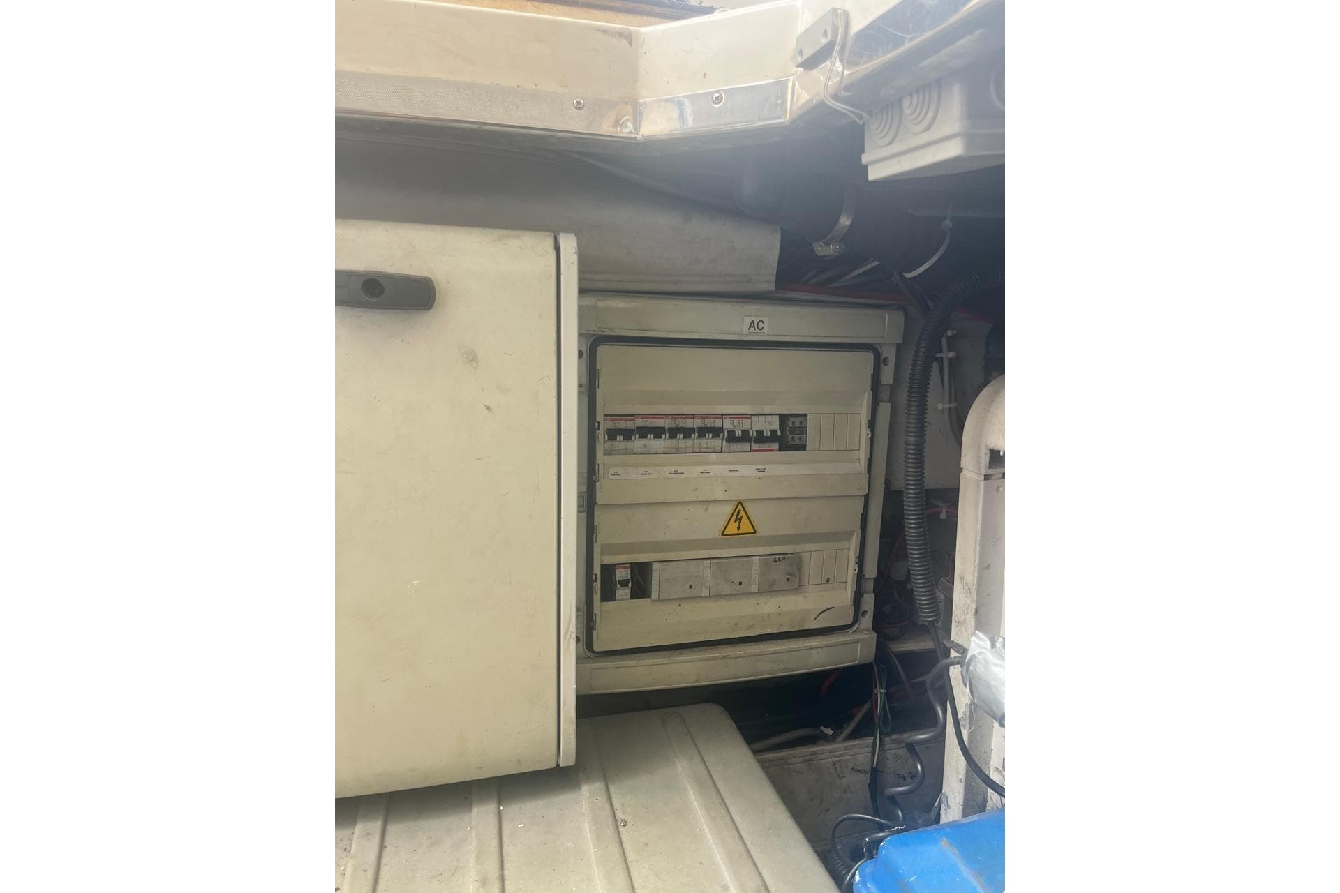 Electrical panel inside 2008 Azimut Flybridge yacht, featuring circuit breakers and wiring.