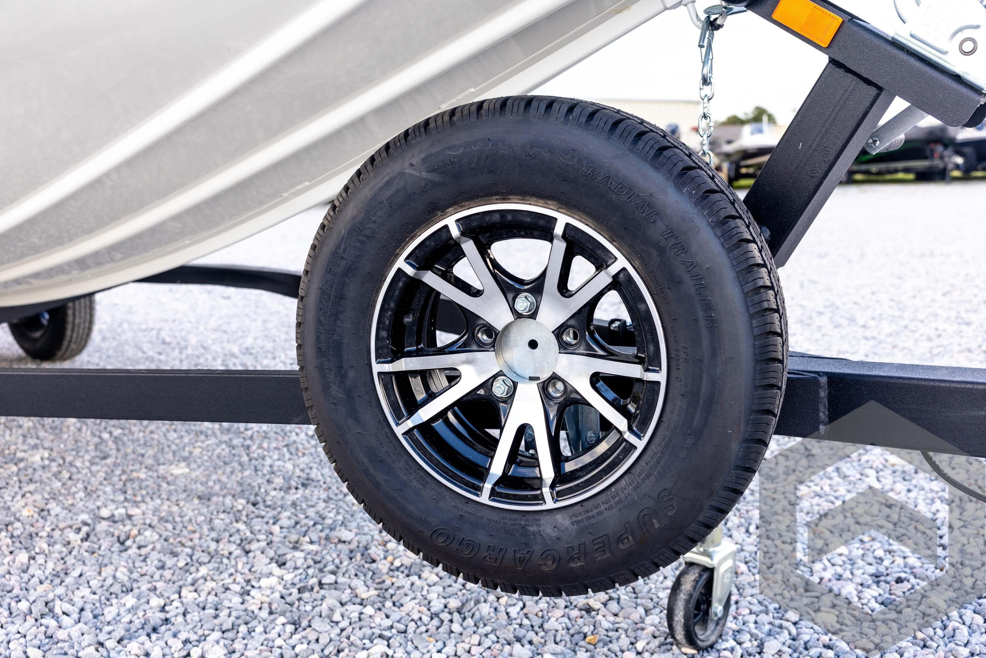 2026 G3 Sportsman 1710 SE trailer wheel on gravel surface.