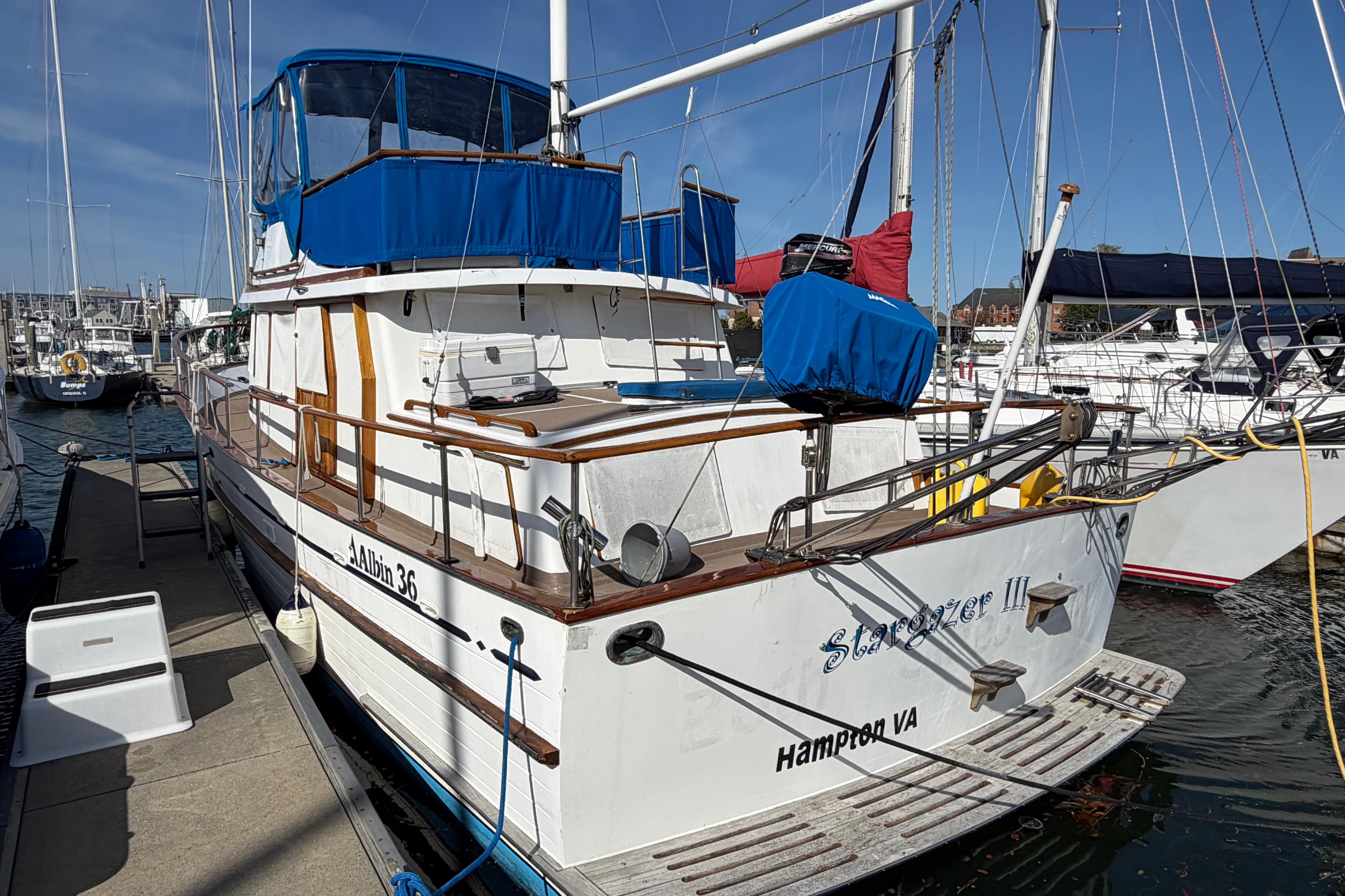 1985 Albin 36 Trawler docked in Hampton, VA, featuring blue canvas covers.