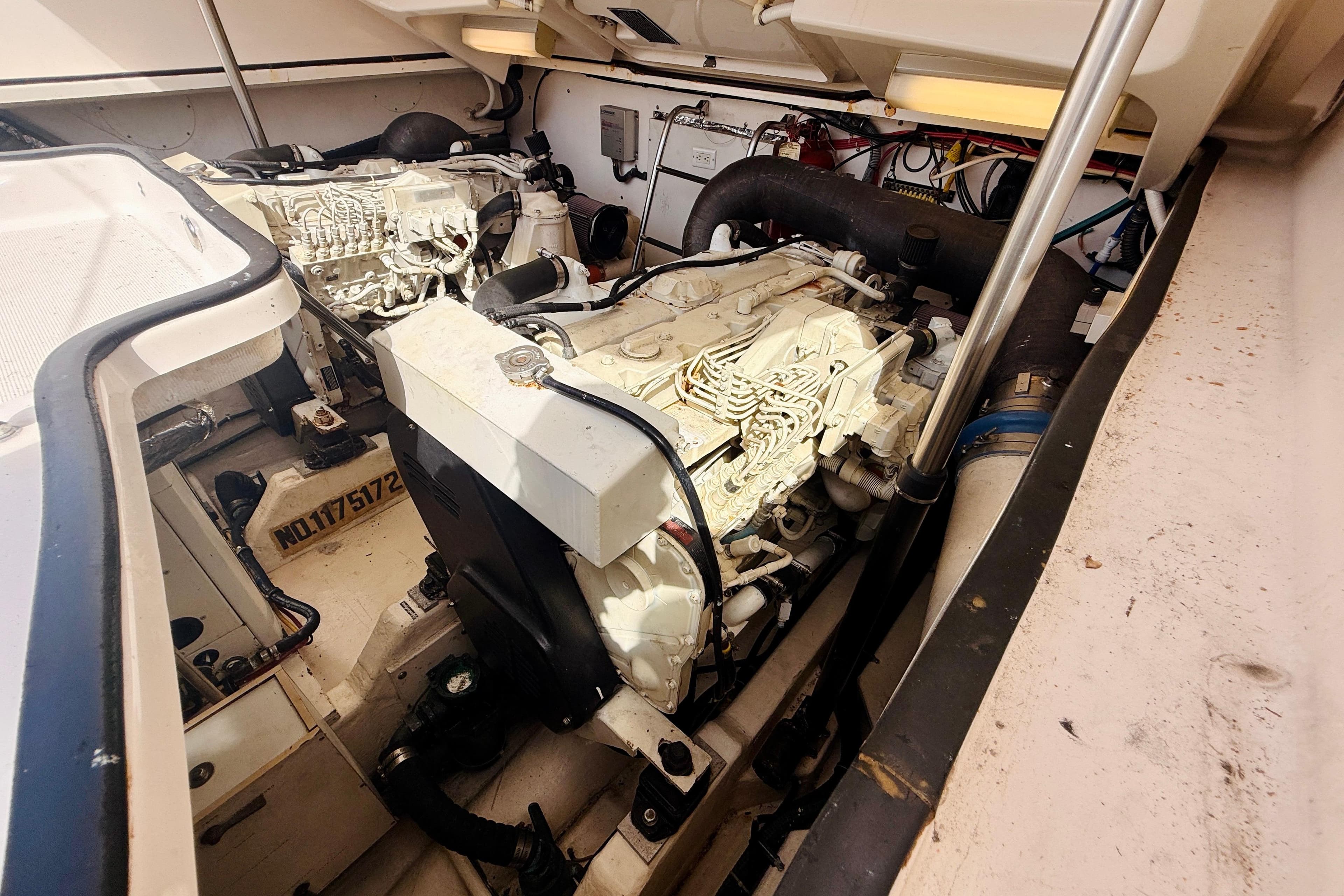 Engine compartment of a 2005 Tiara Yachts 3600 Sovran, showcasing dual engines and mechanical components.