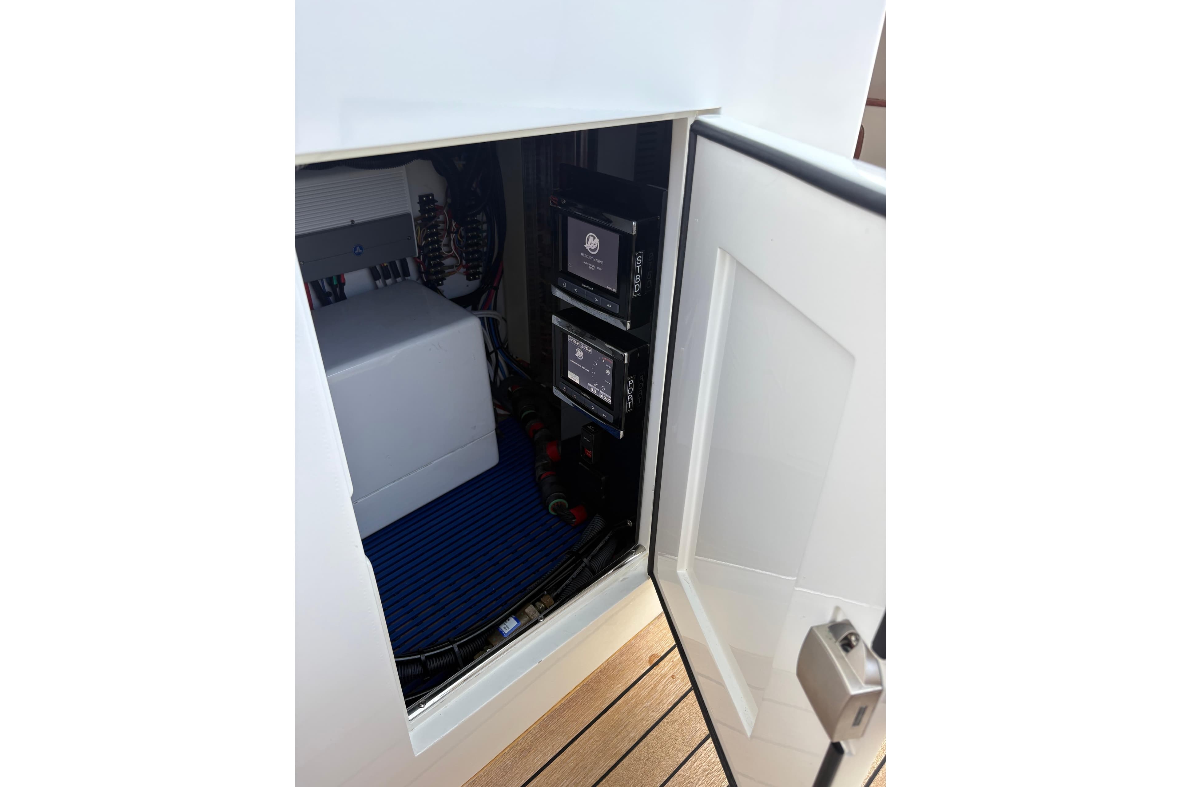 Electrical compartment of 2007 Gamefisherman 42 Walkaround, showcasing wiring and control panels.
