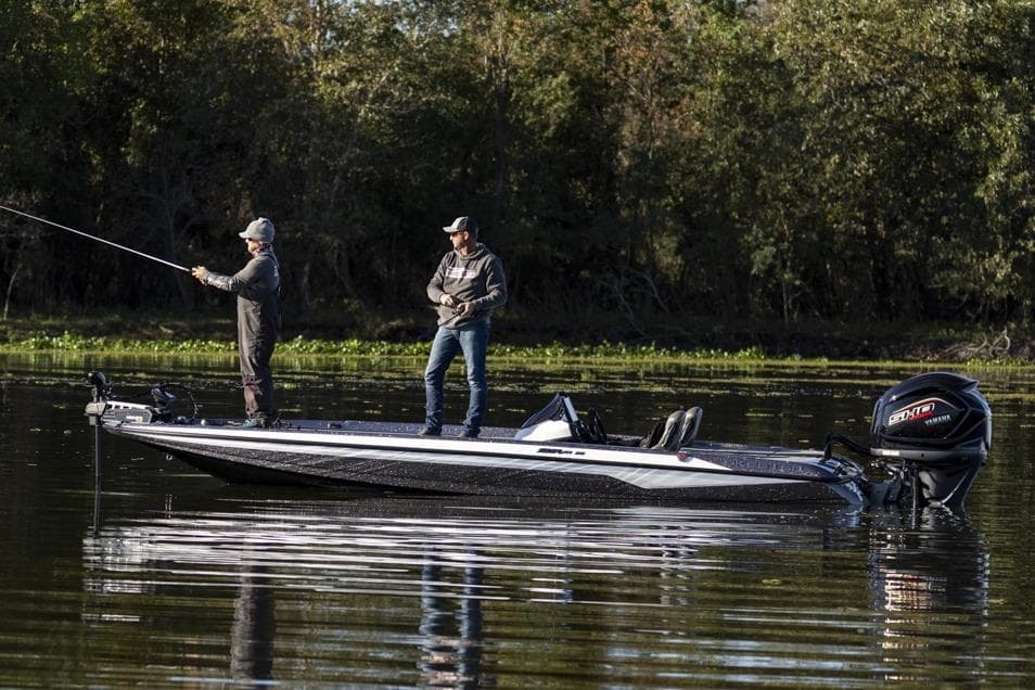 Manufacturer Provided Image: Two people fishing on a 2026 Skeeter ZXR21 SE boat in a serene lake.
