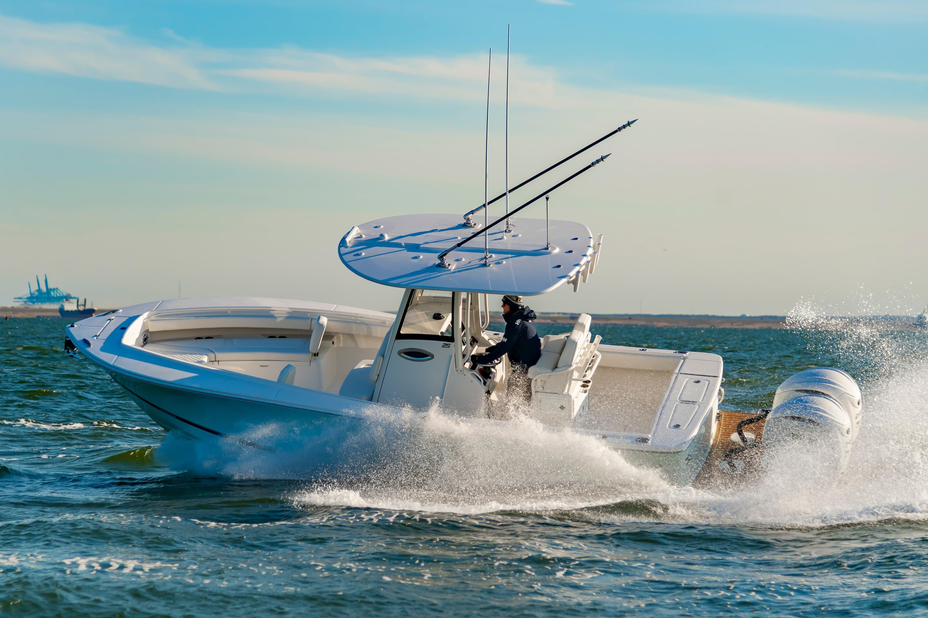 2026 Regulator 25 boat cruising on open water, showcasing sleek design and powerful engines.