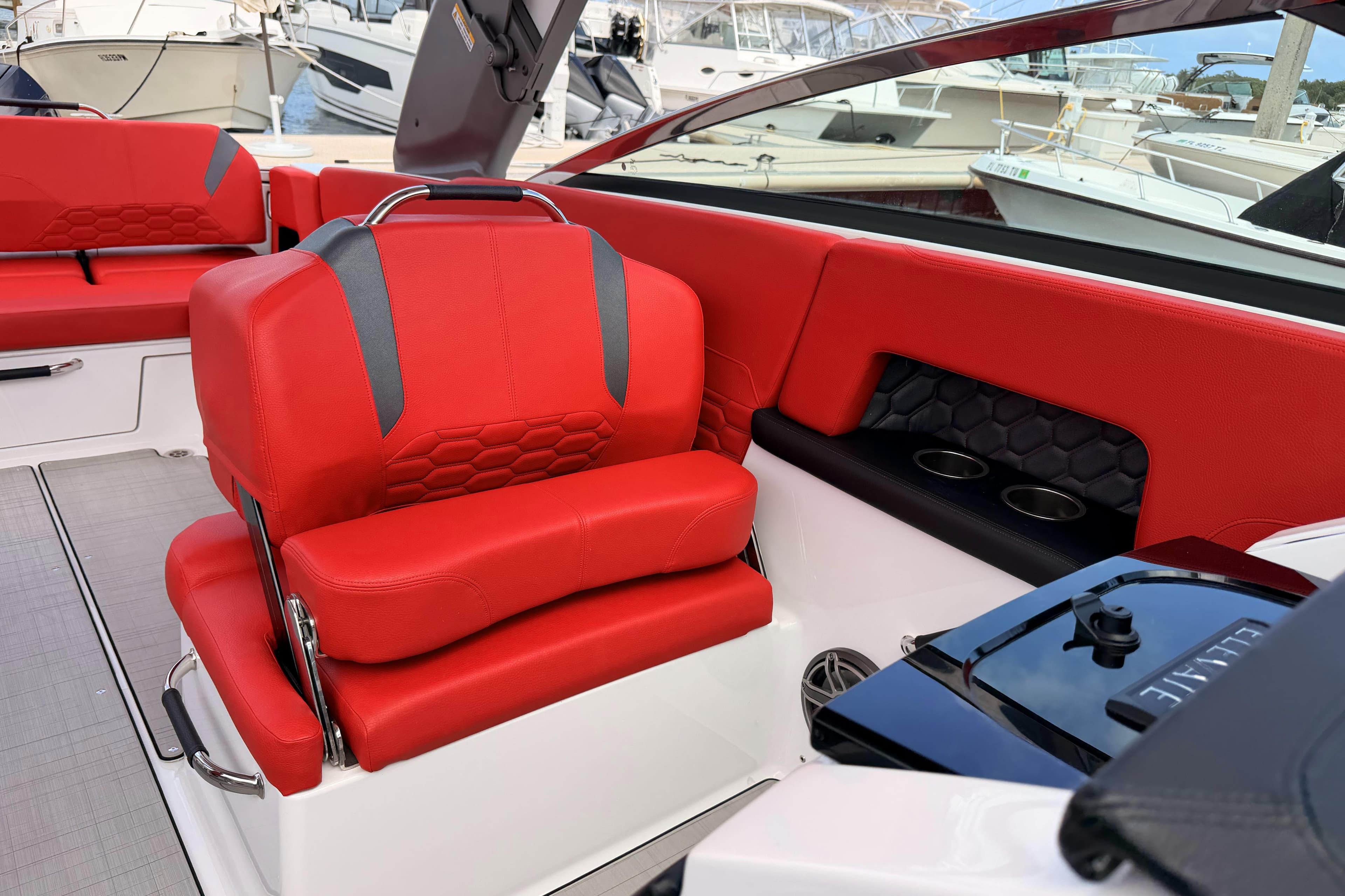 2025 Four Winns H9 OB boat interior with red seating and modern design.