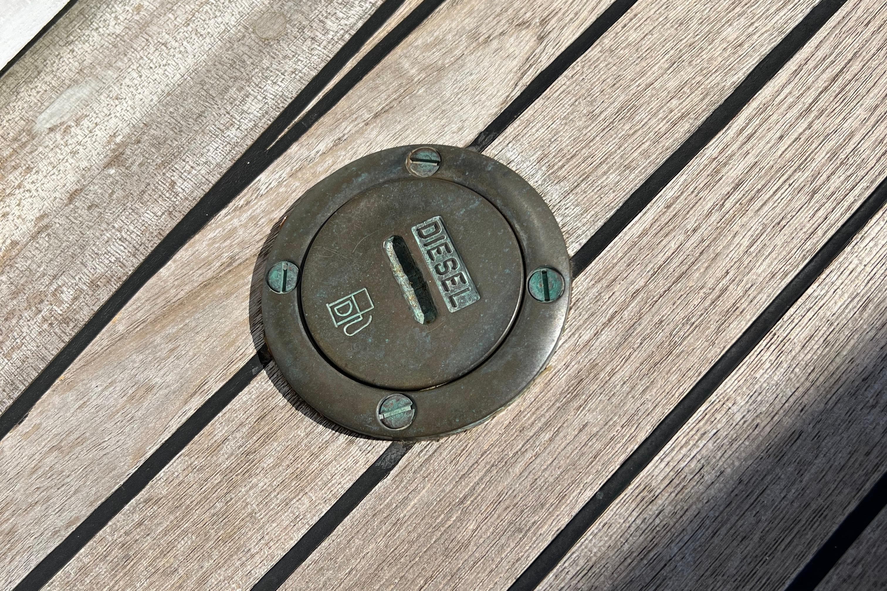 Diesel fuel cap on 1980 EUROVOILE Cotre Breton boat deck.