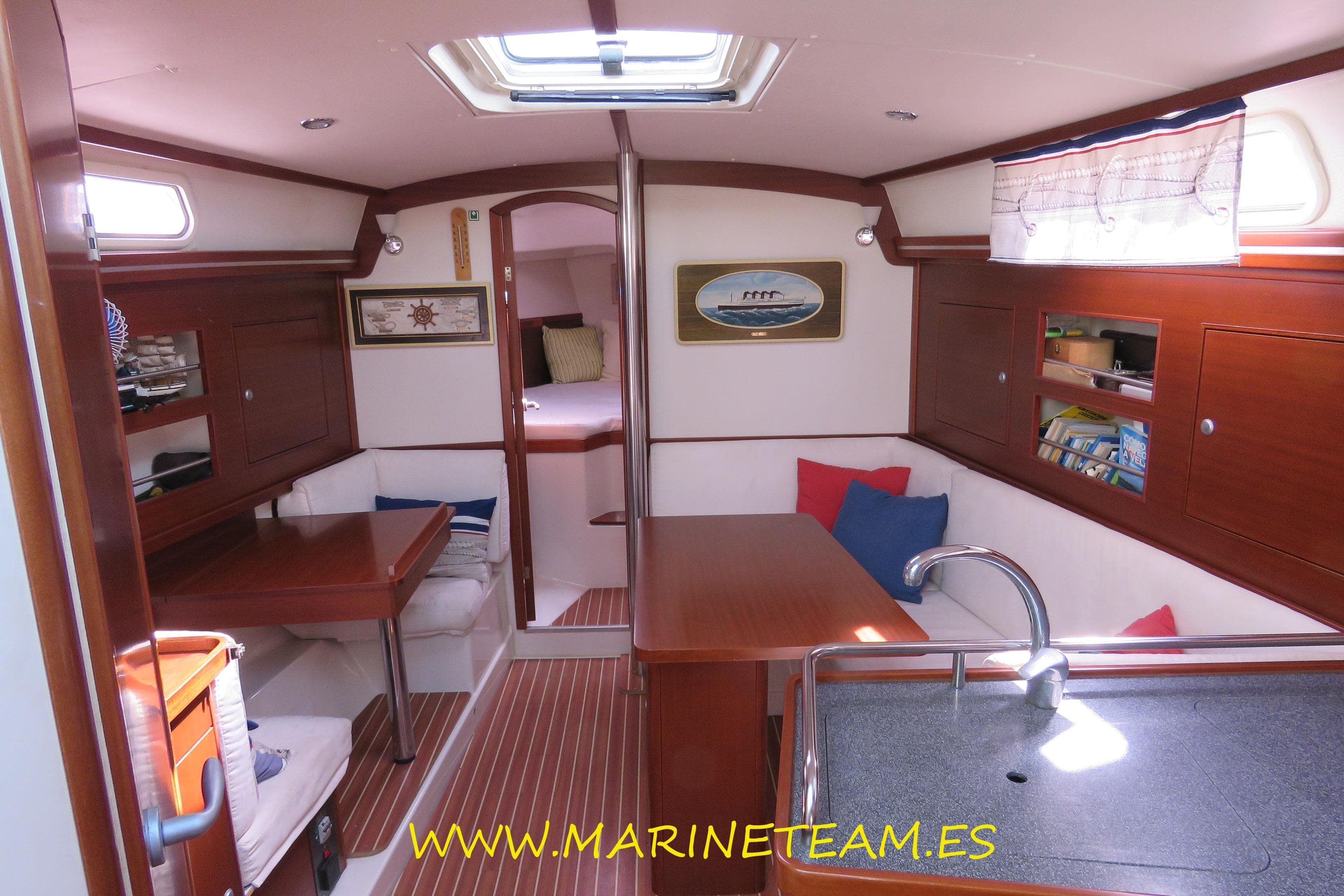 Interior of 2007 Hanse 342 yacht with cozy seating and wooden finishes.