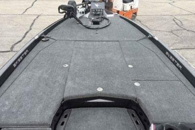 2026 Skeeter ZXE21 boat deck with carpeted surface and storage compartments.