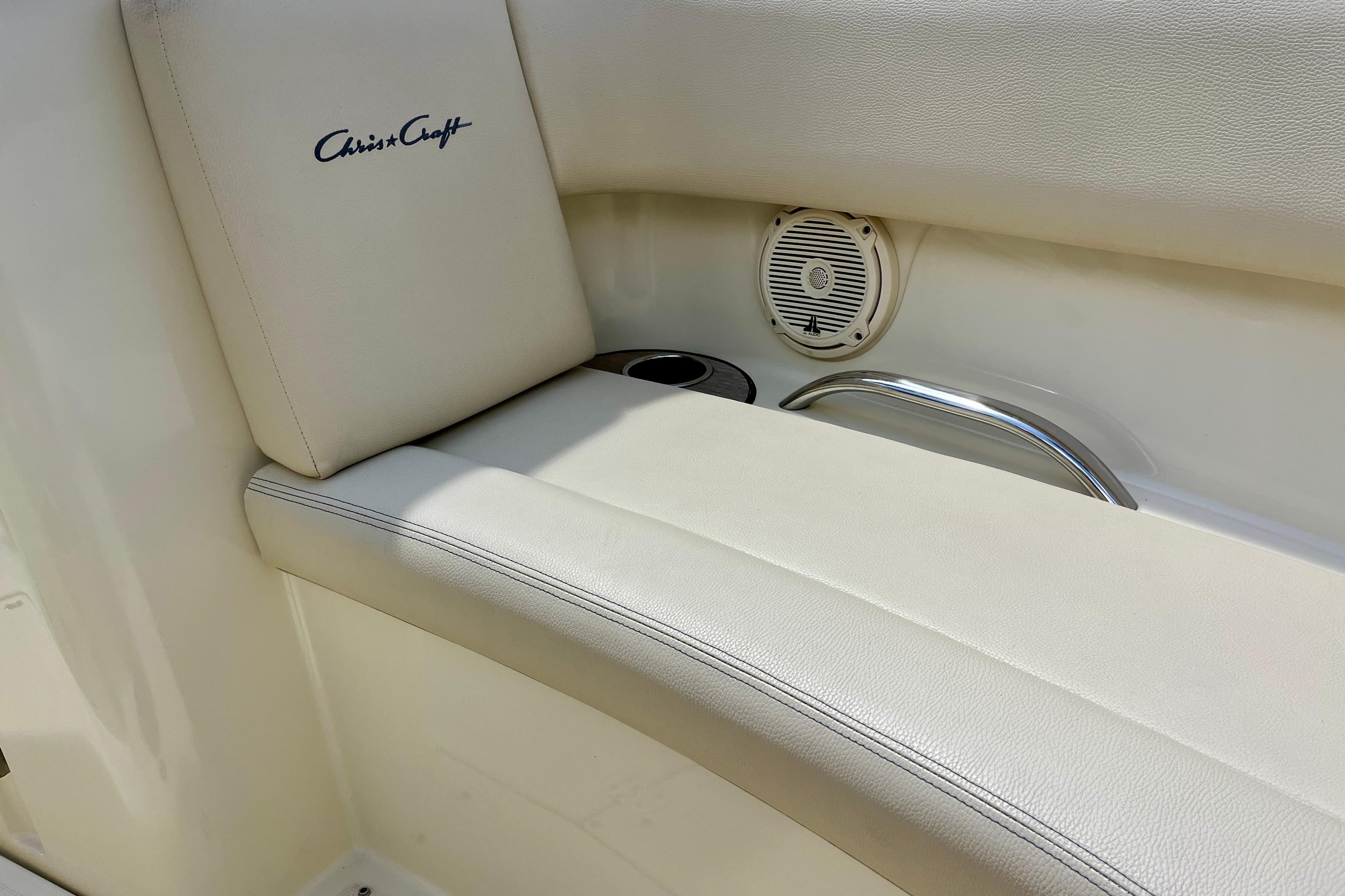 2019 Chris-Craft Launch 27 interior with logo, speaker, and cup holder.