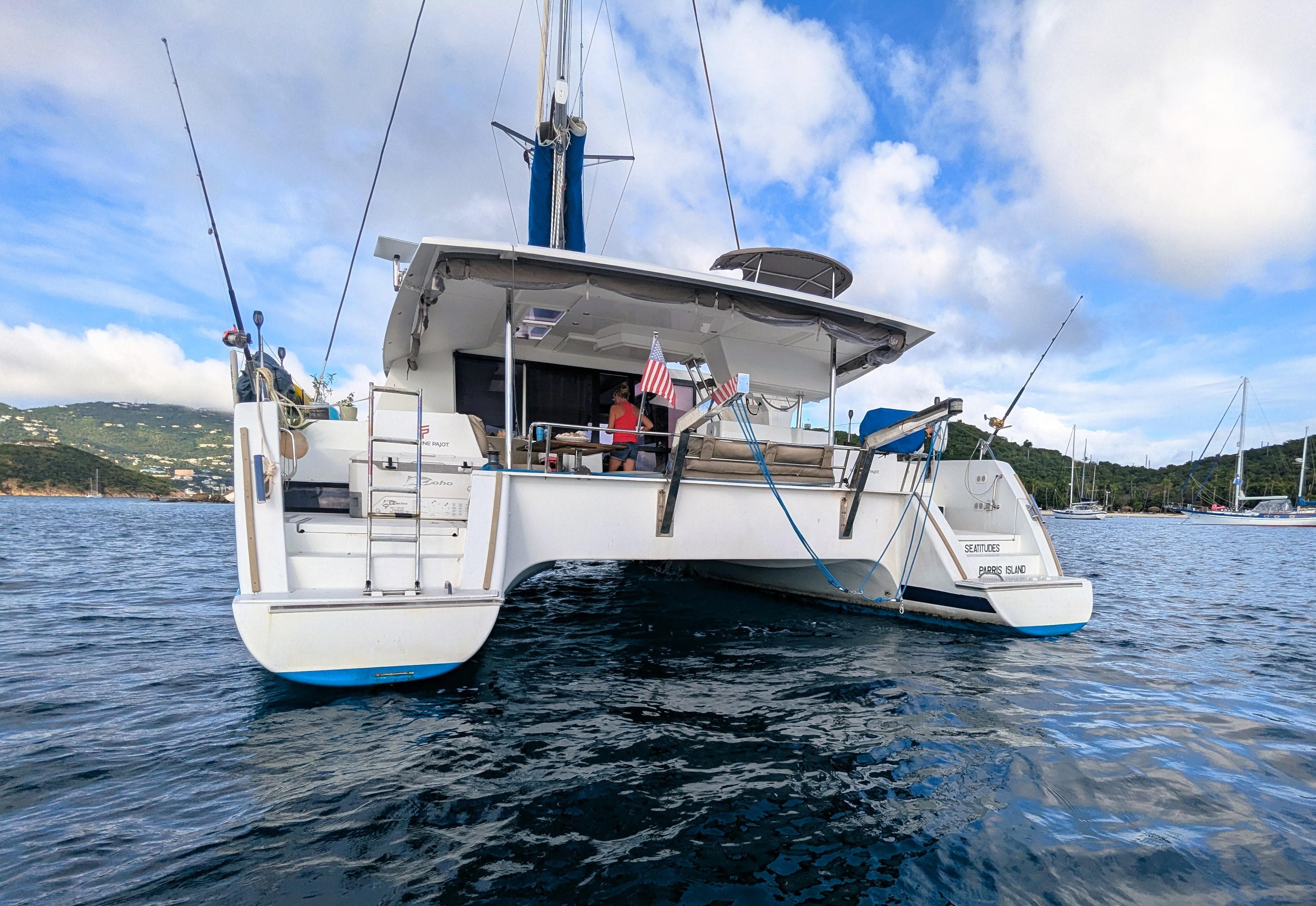 2017 Fountaine Pajot Helia 44 Evolution catamaran on calm water, rear view.