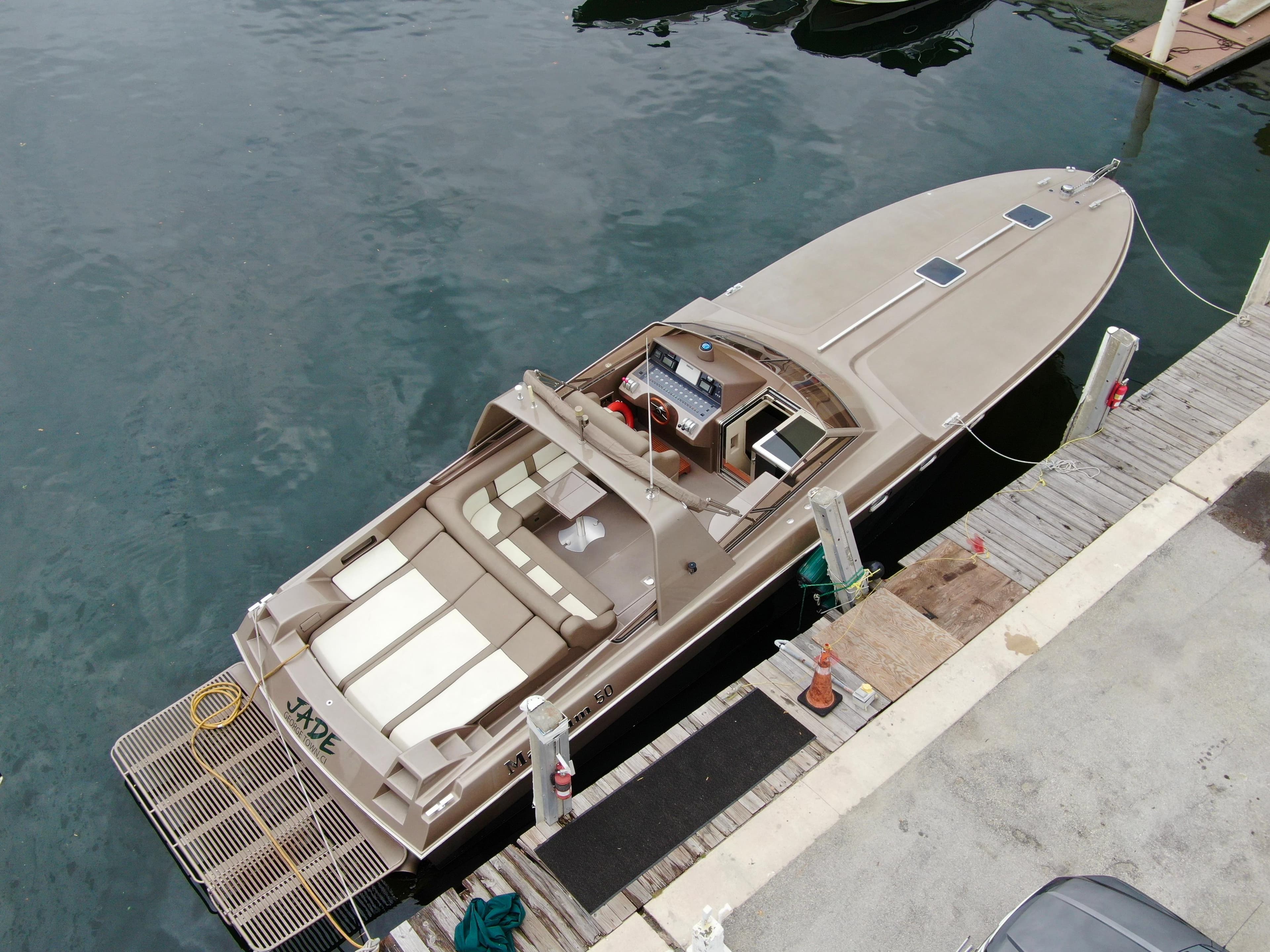 Aerial view of a 1998 Magnum 50 Bestia yacht docked at a marina.