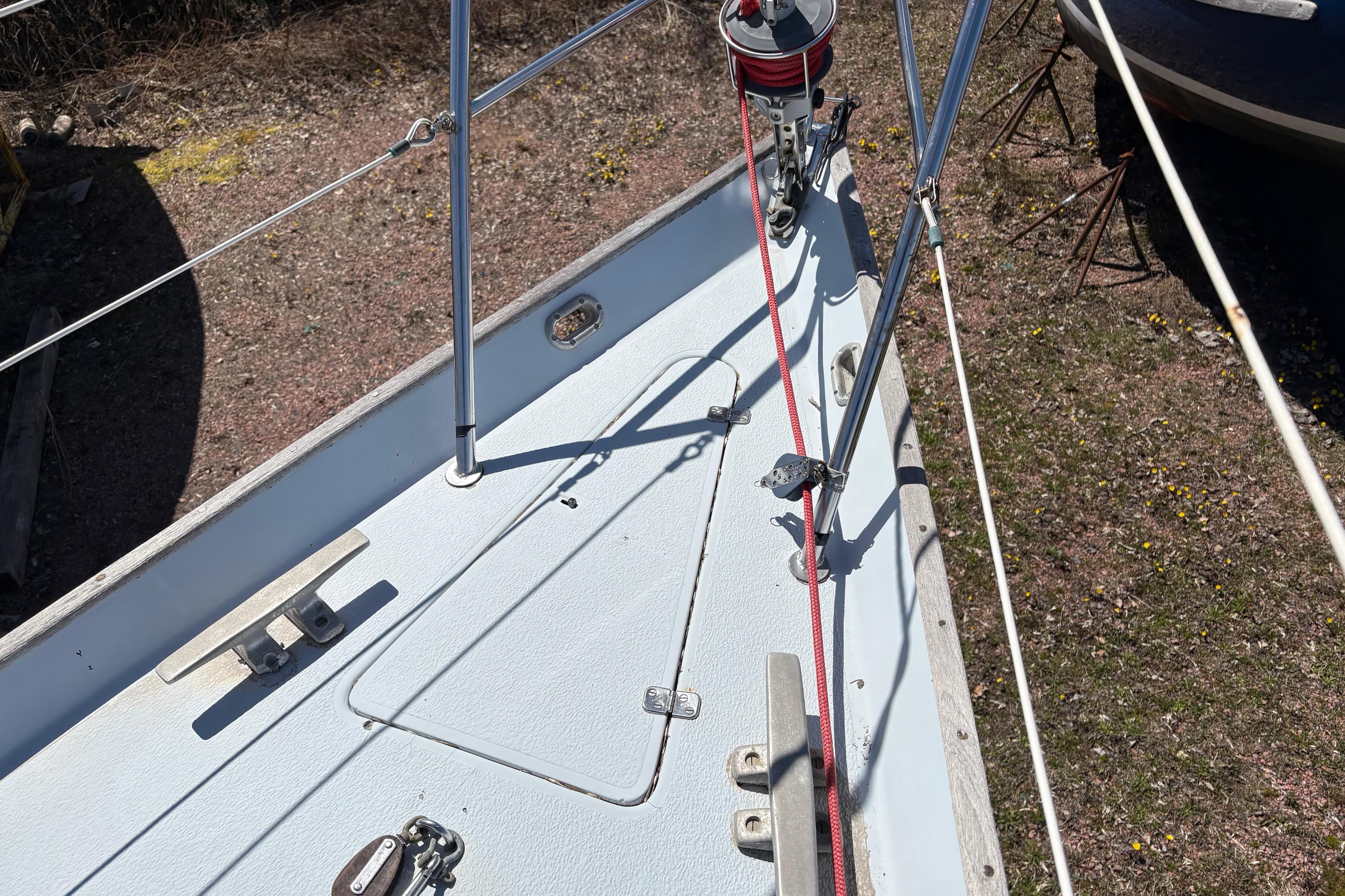 Deck of a 1979 Contessa 32 sailboat with rigging and fittings.