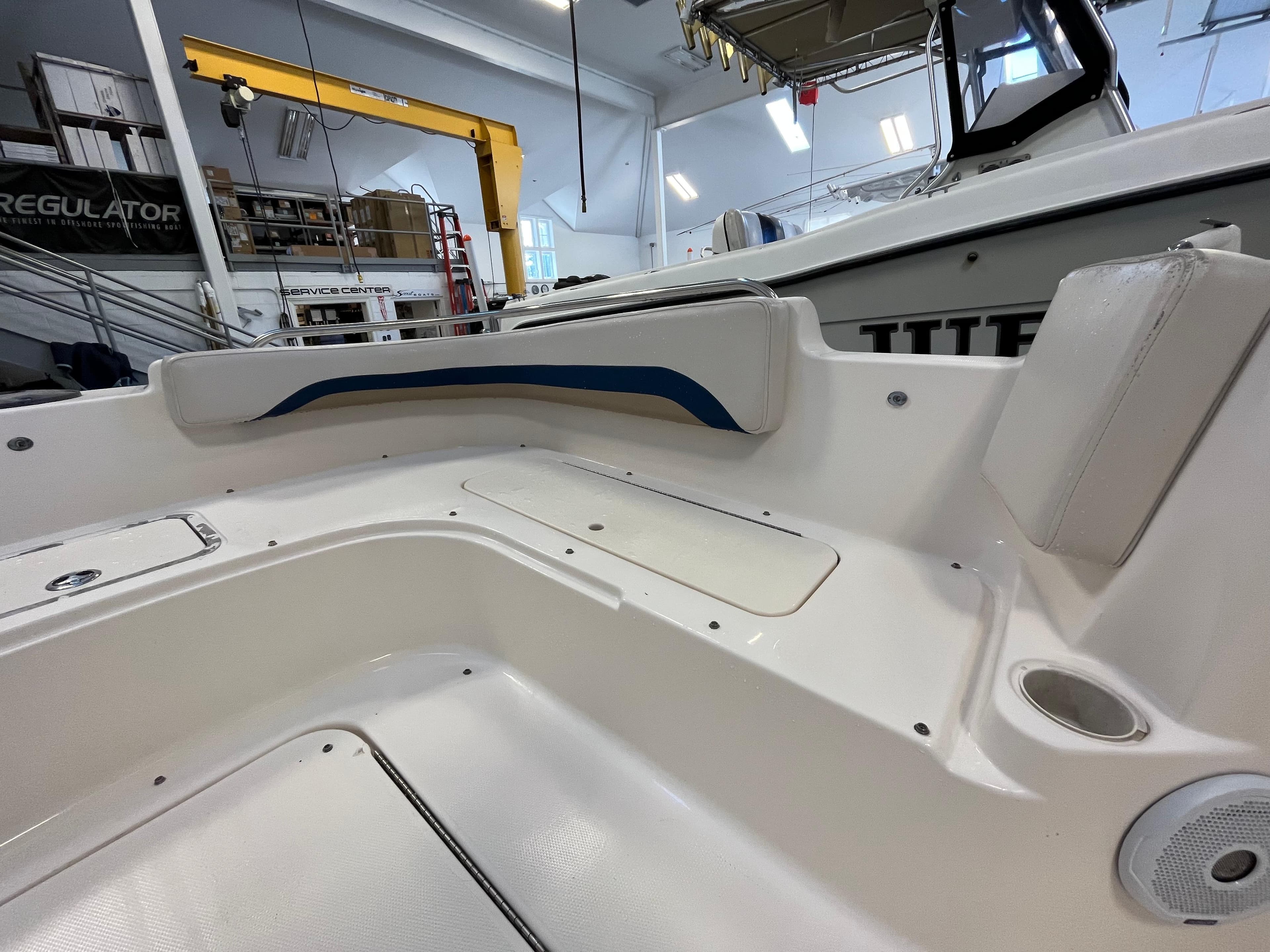 Interior view of a 2005 Godfrey FD211 boat, showcasing seating and storage areas.