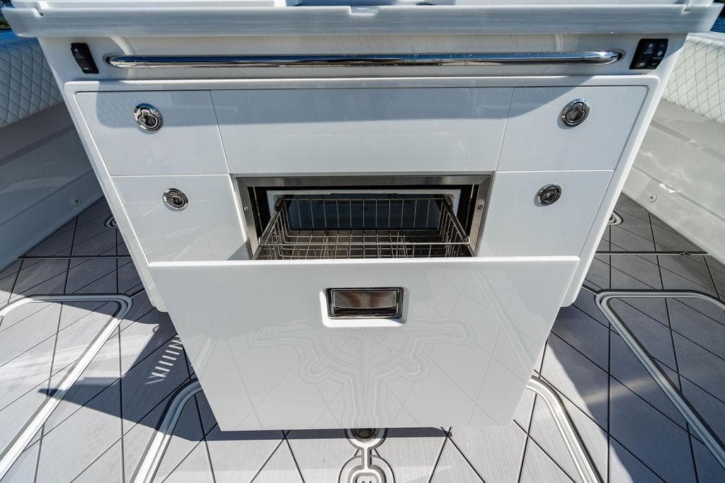 2024 HCB 42 Lujo boat interior with sleek white cabinetry and modern design.