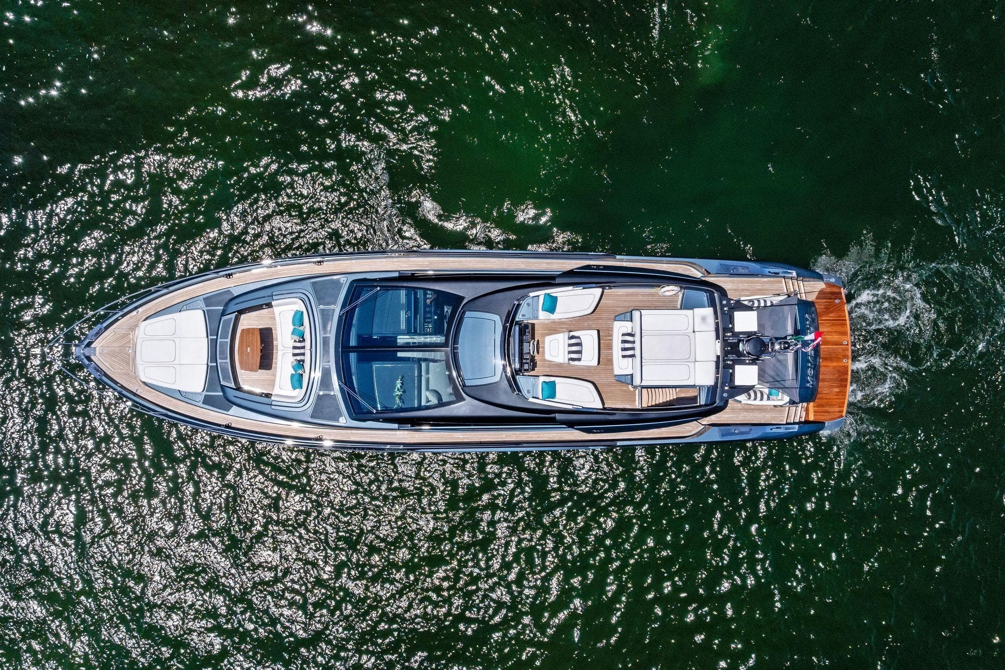Aerial view of 2024 Riva 76 PERSEO Super yacht cruising on water.