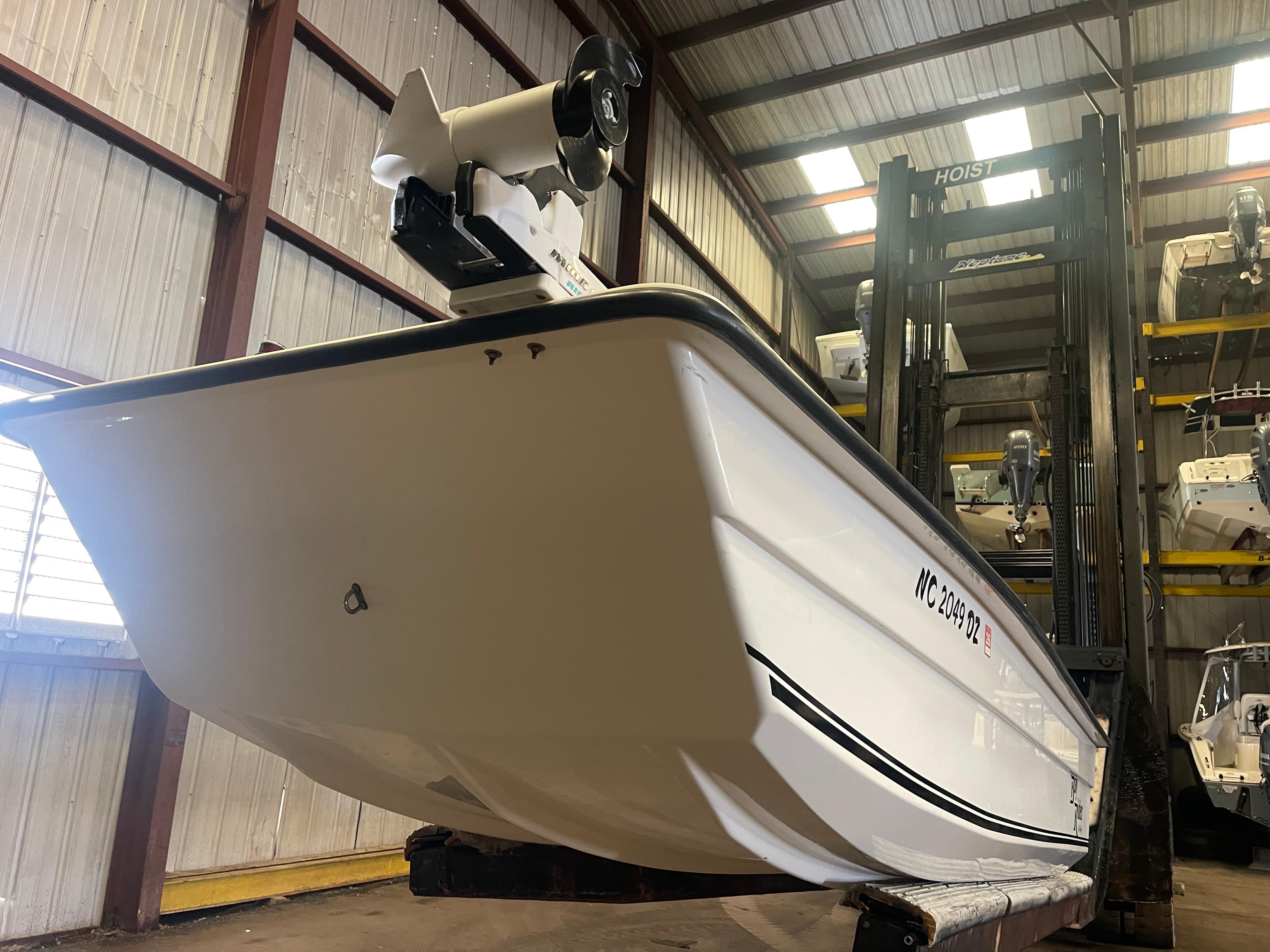 2013 KenCraft Bay Rider 1860 boat in warehouse, elevated on forklift.