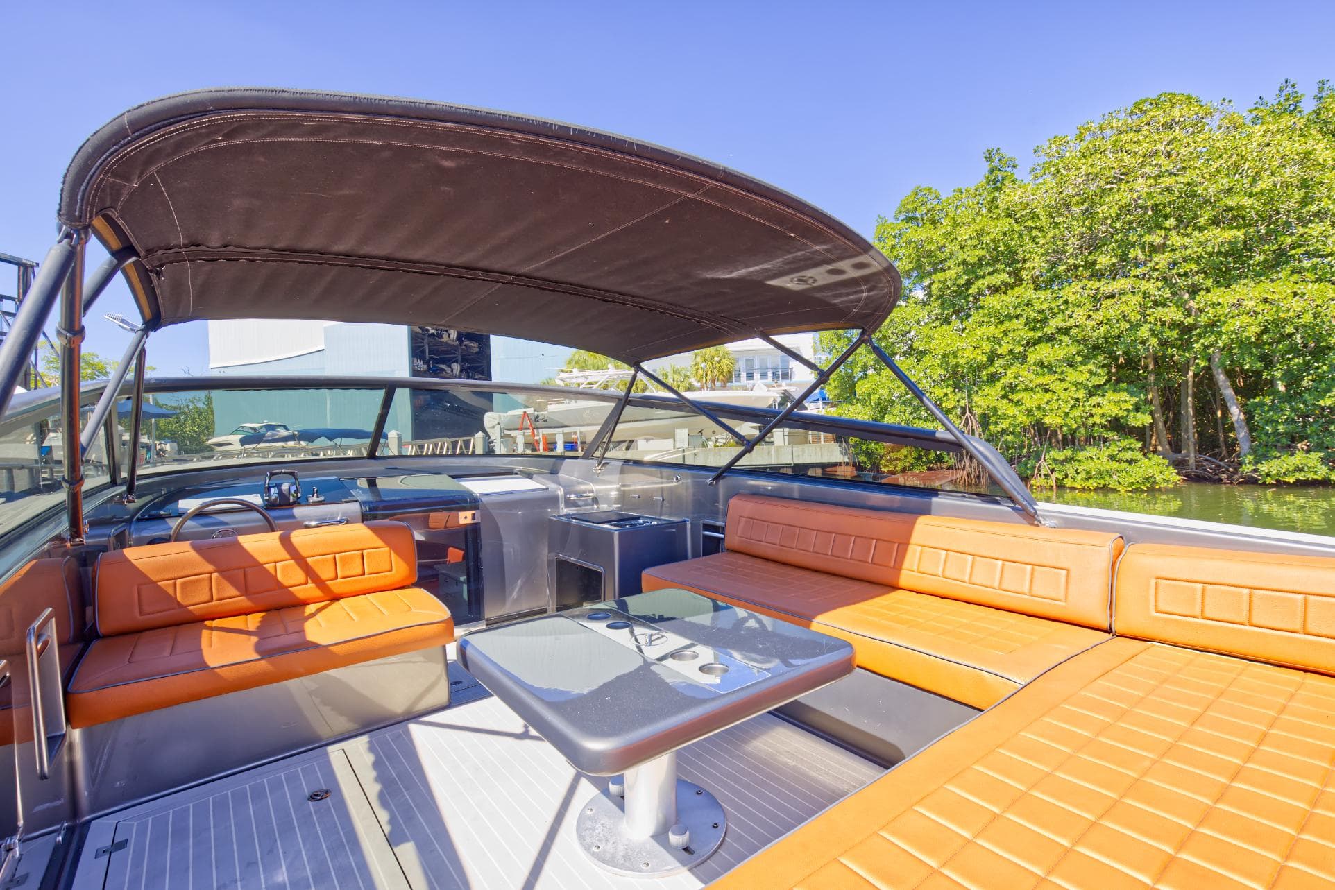 2015 VanDutch 40 yacht with orange seating and canopy.