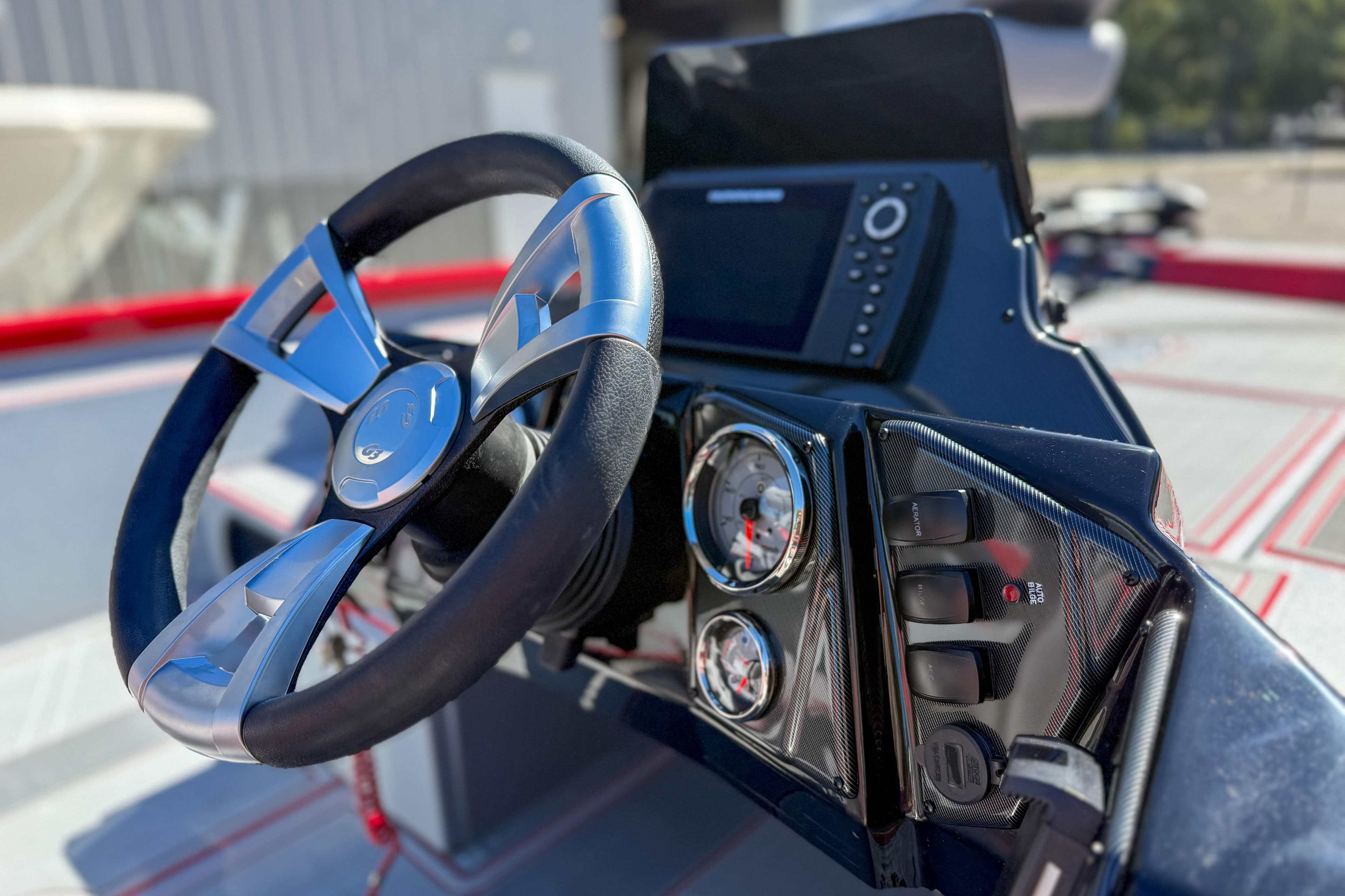 2026 G3 Sportsman 1710 SE boat dashboard with steering wheel and gauges.