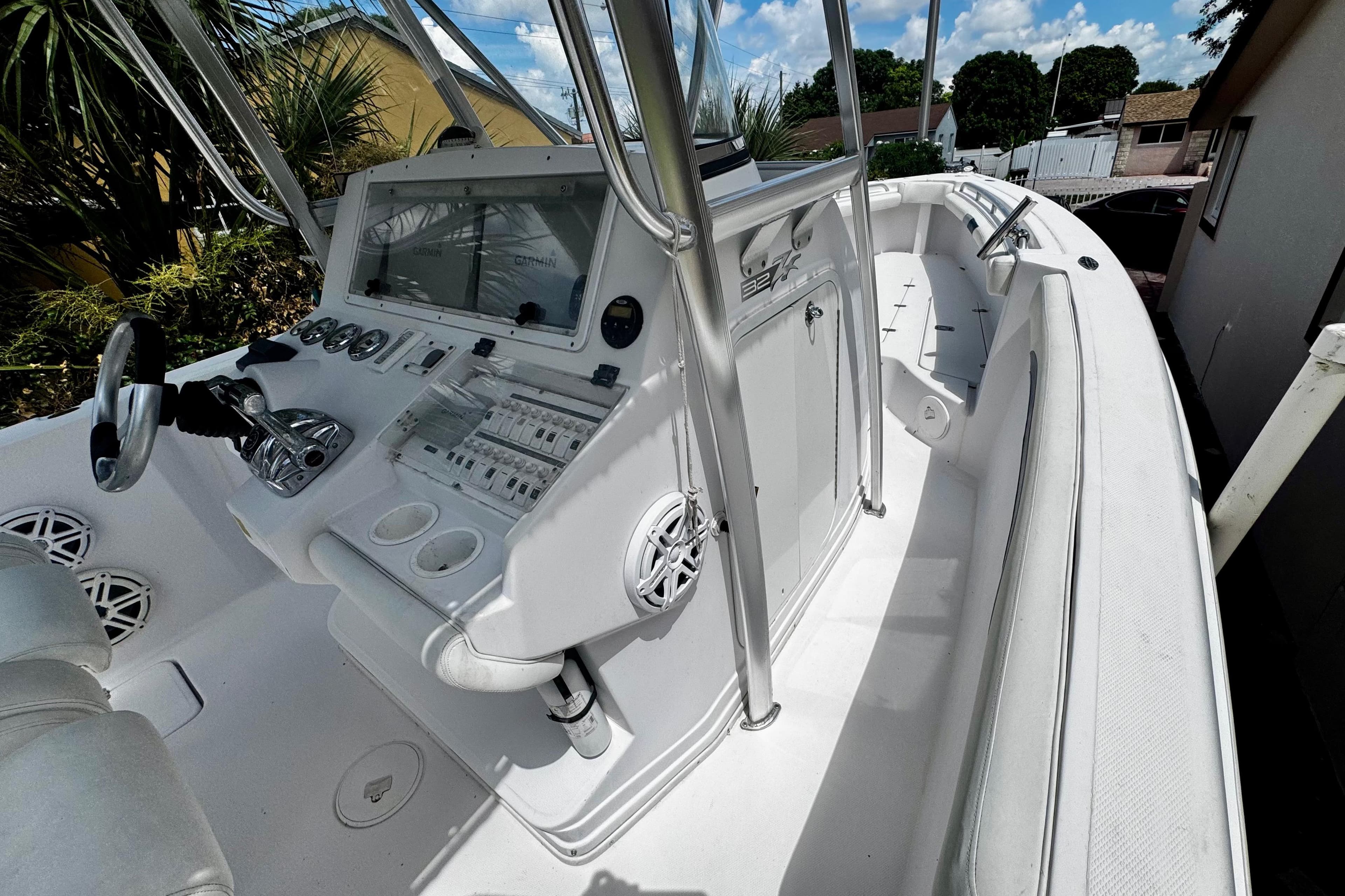 2006 Donzi 32 ZF boat interior with steering console and seating.