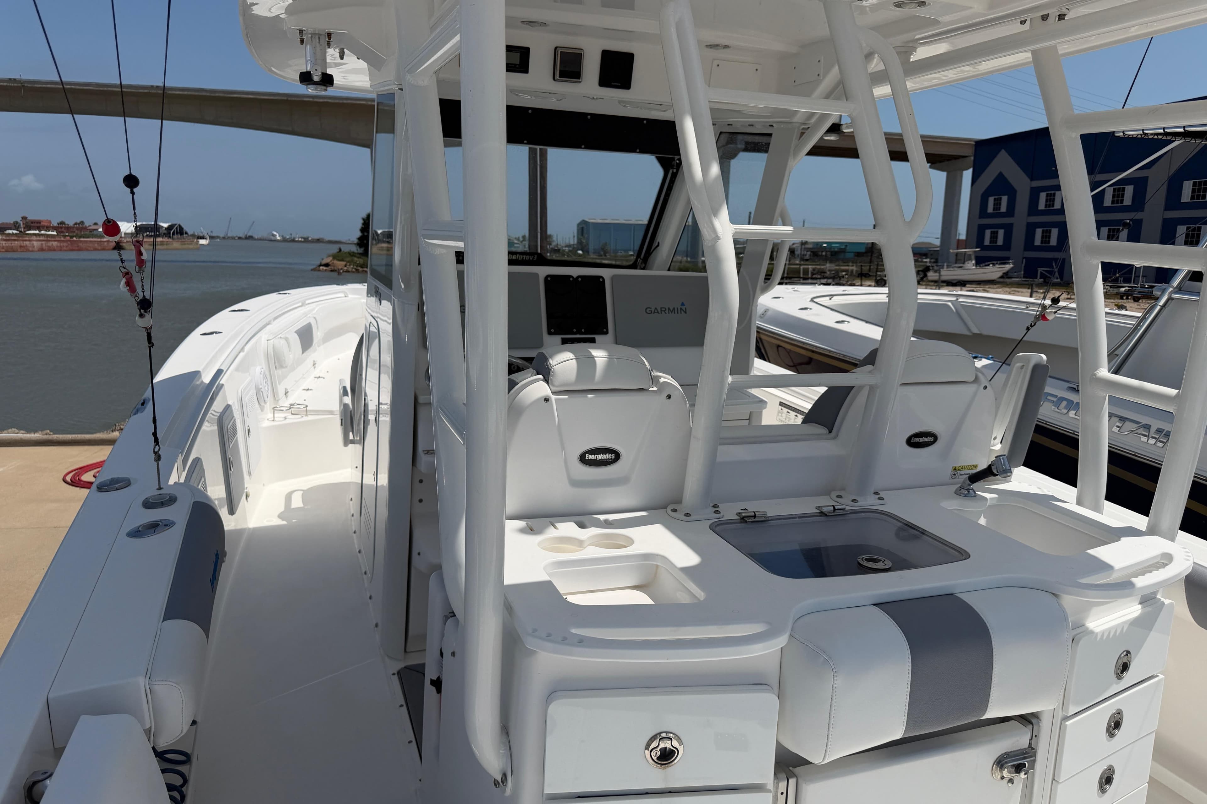 2018 Everglades 355 Center Console boat docked, featuring spacious deck and modern amenities.