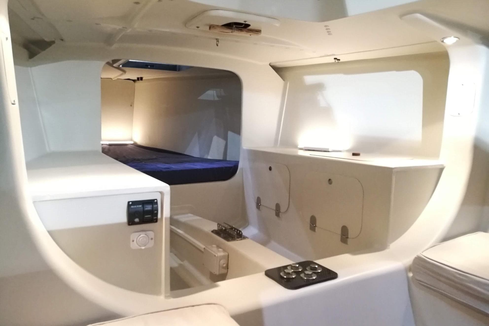 Interior of 2026 Brenta 30 yacht, featuring modern design and compact storage.