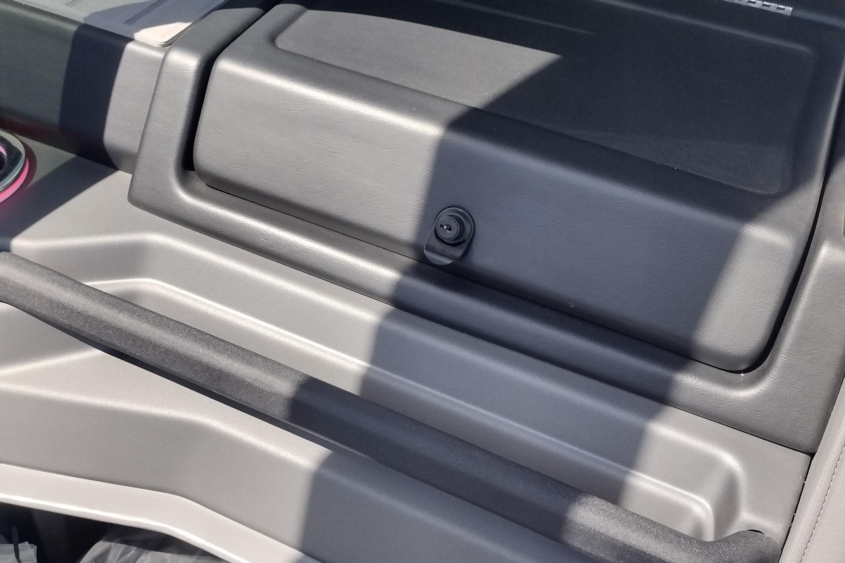 Dashboard of 2026 Tahoe Pontoon Grand Tahoe 27' boat, featuring sleek design elements.