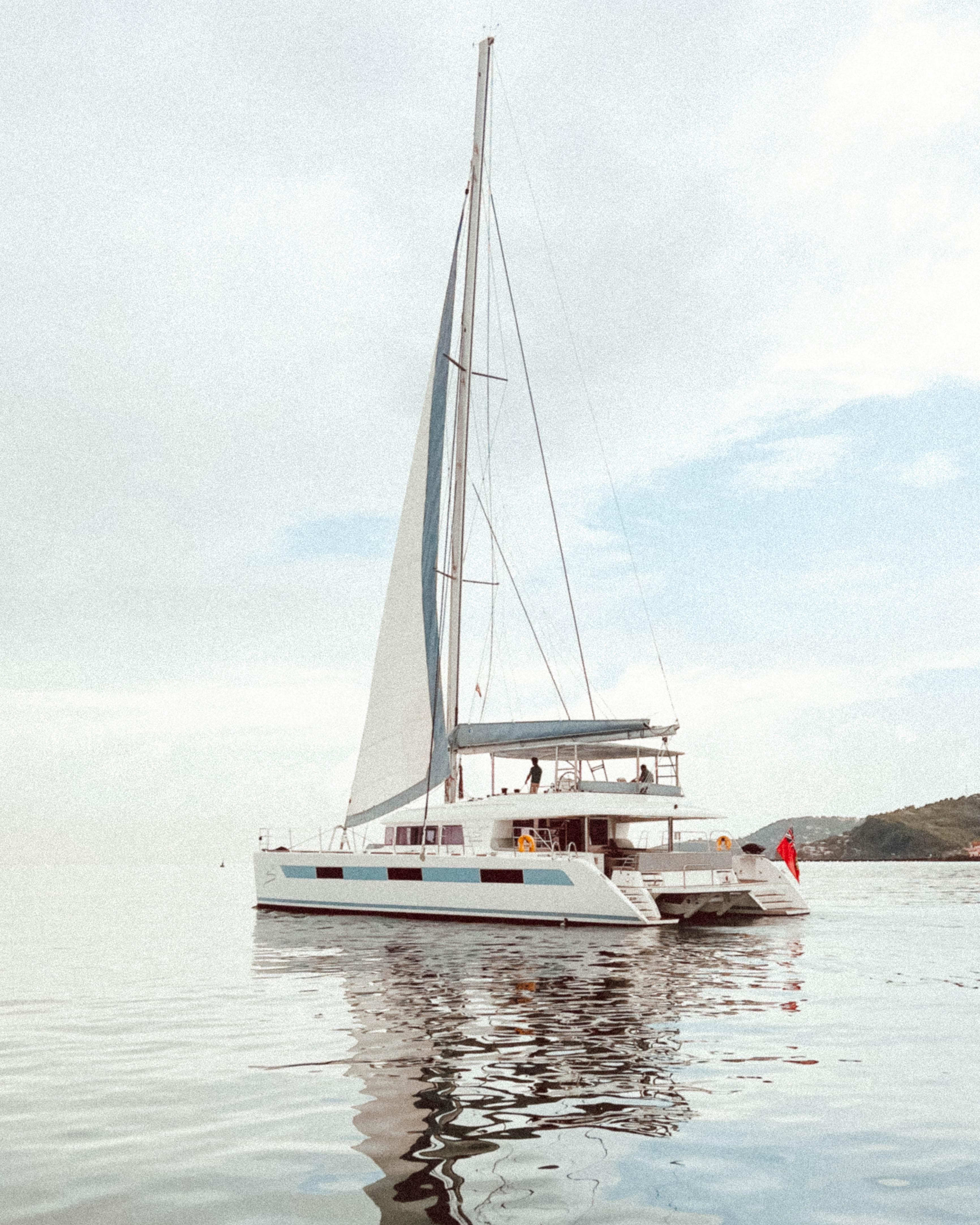 2014 Lagoon 620 catamaran sailing on calm waters.