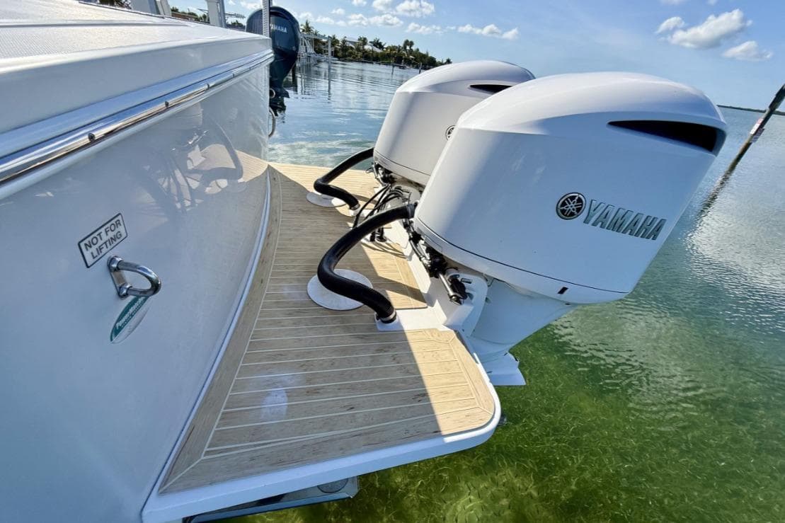 2019 Regulator 31 boat with twin Yamaha outboard engines on a sunny day.
