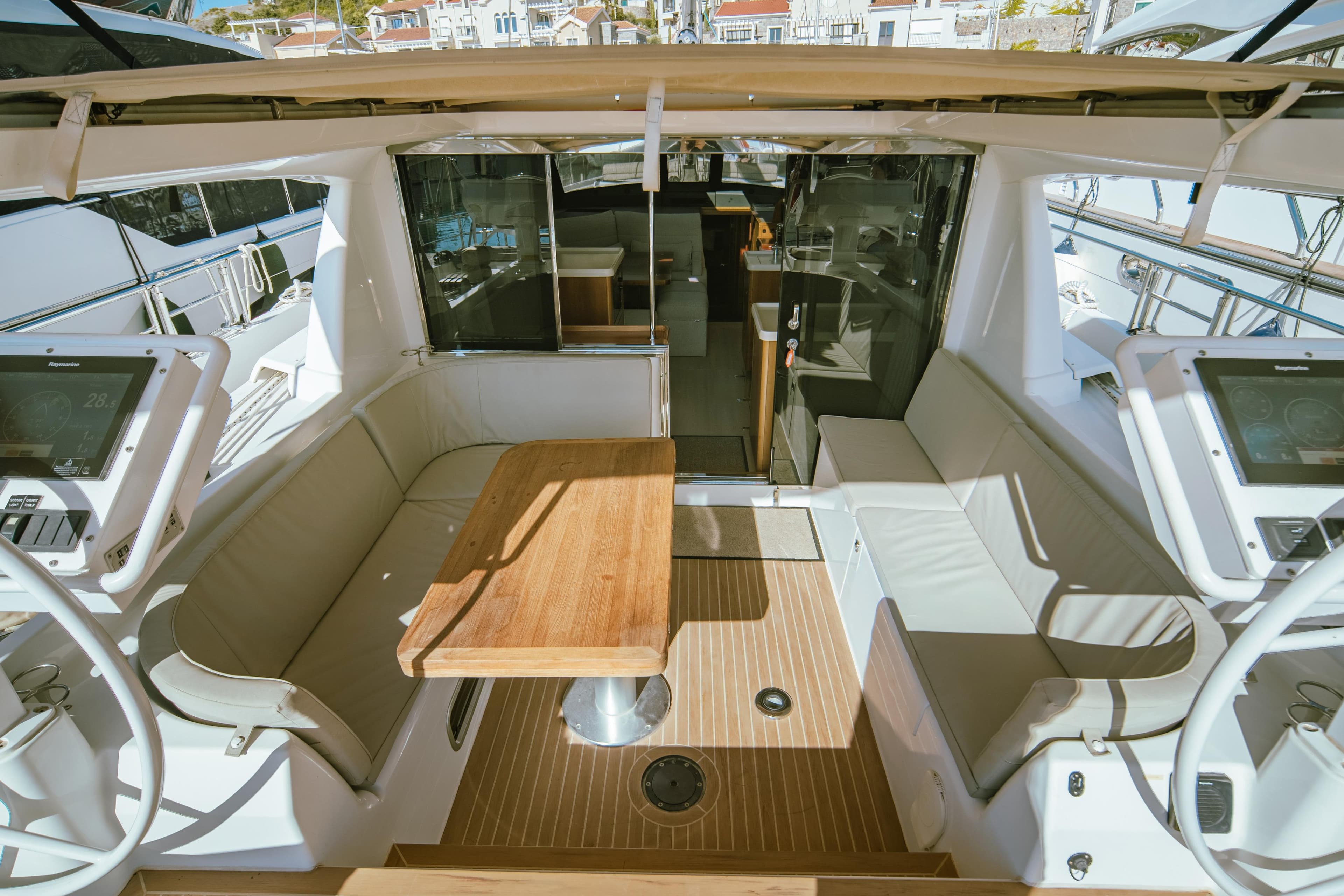 Luxurious 2016 Moody 54 DS yacht cockpit with seating and navigation displays.