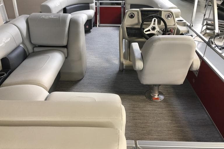 Interior of 2026 SunChaser Vista 20 CRB pontoon boat with plush seating and modern helm.