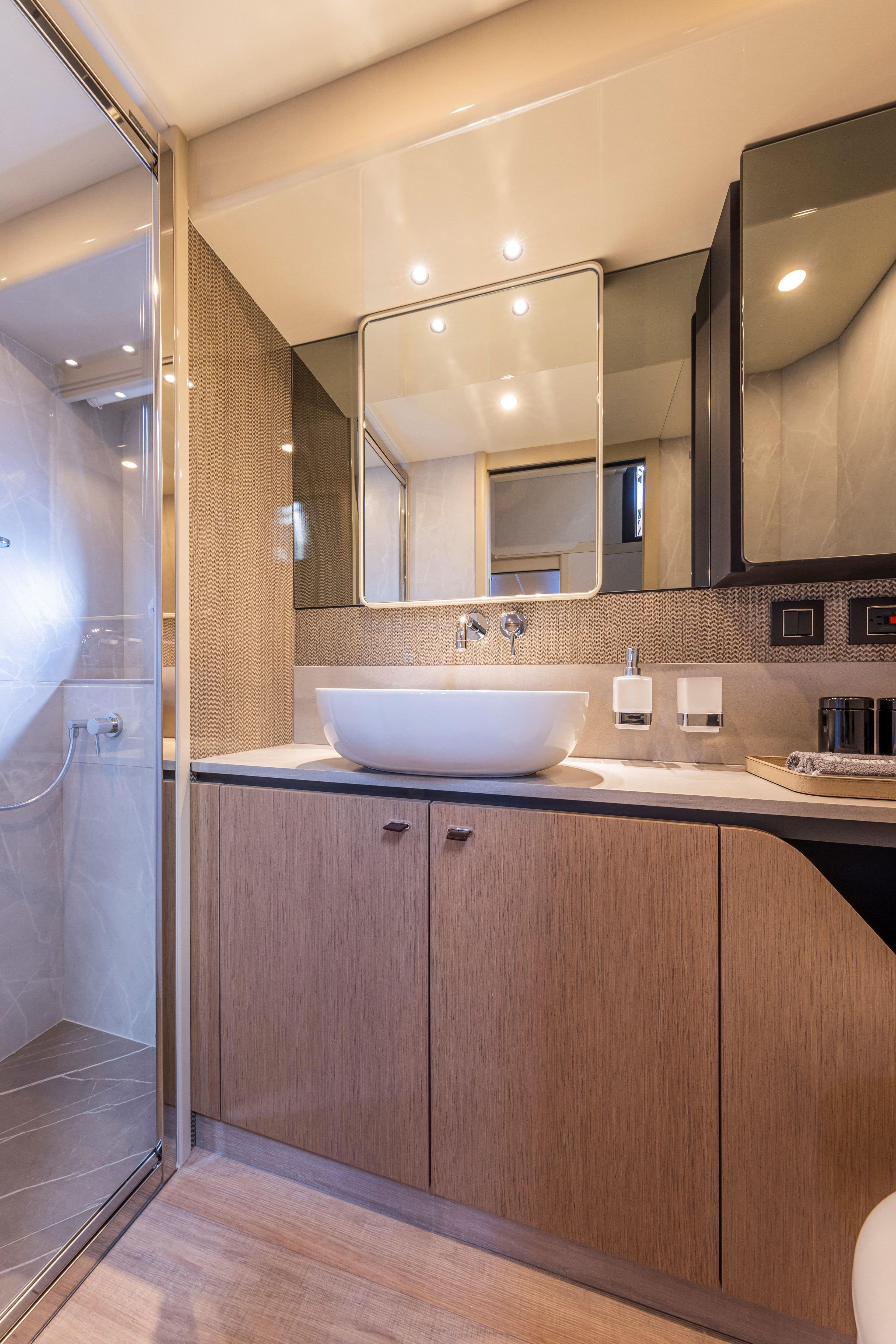Luxurious bathroom in 2025 Absolute 56 FLY yacht with modern fixtures and elegant design.