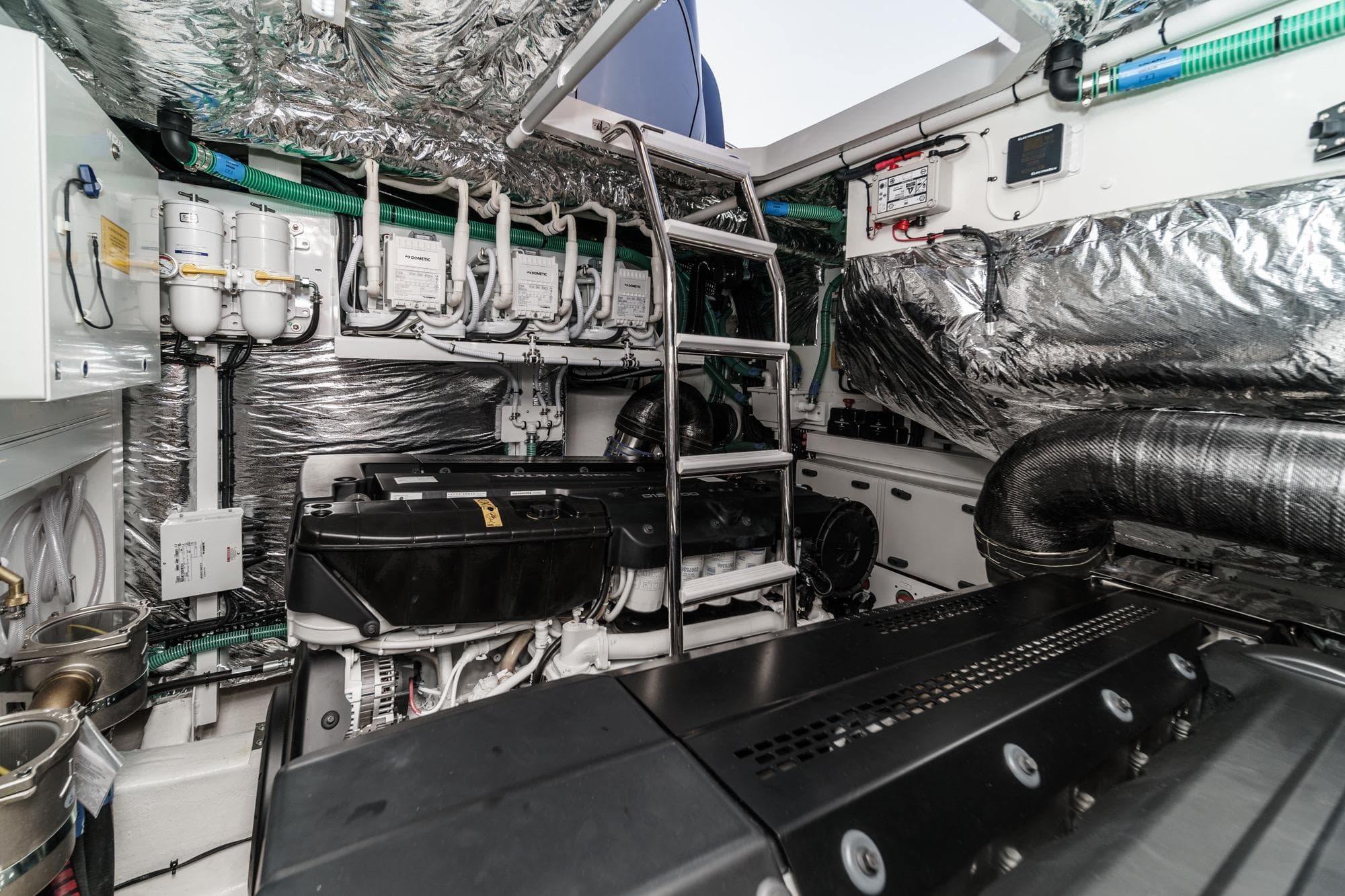 Engine room of 2026 Princess V55 yacht, featuring advanced machinery and metallic insulation.