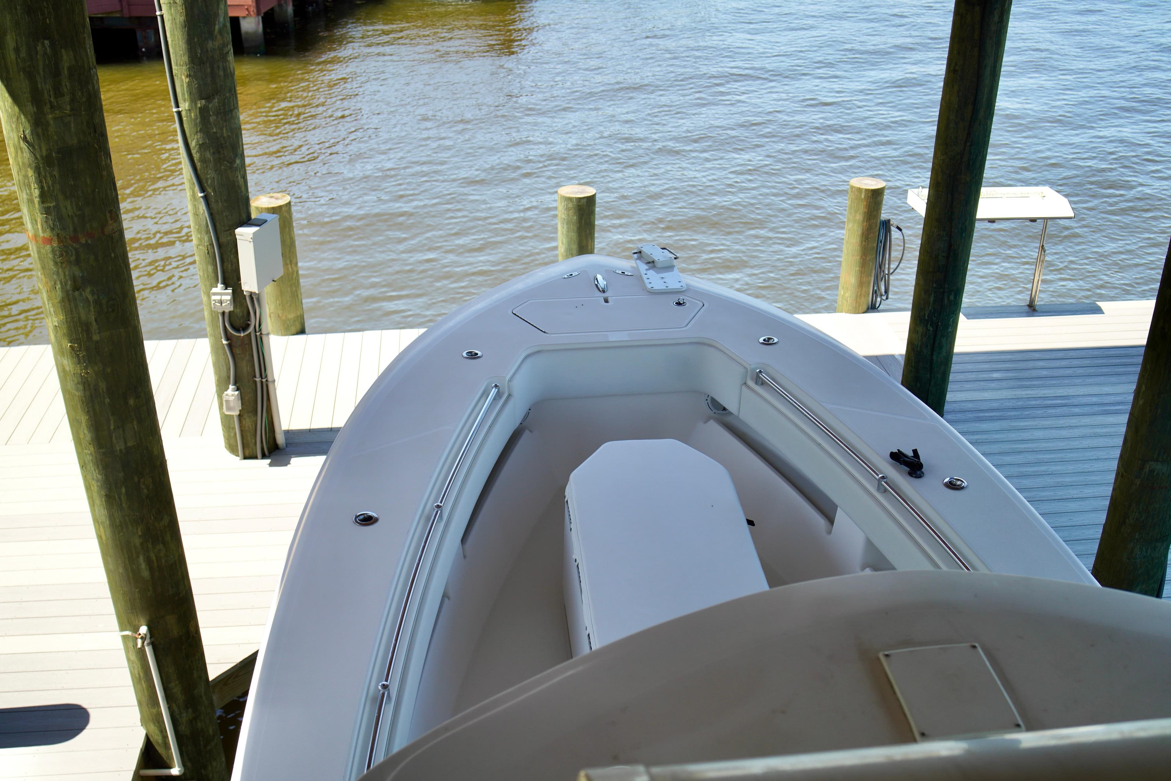 2019 Invincible 36 Open Fisherman boat docked by the water.