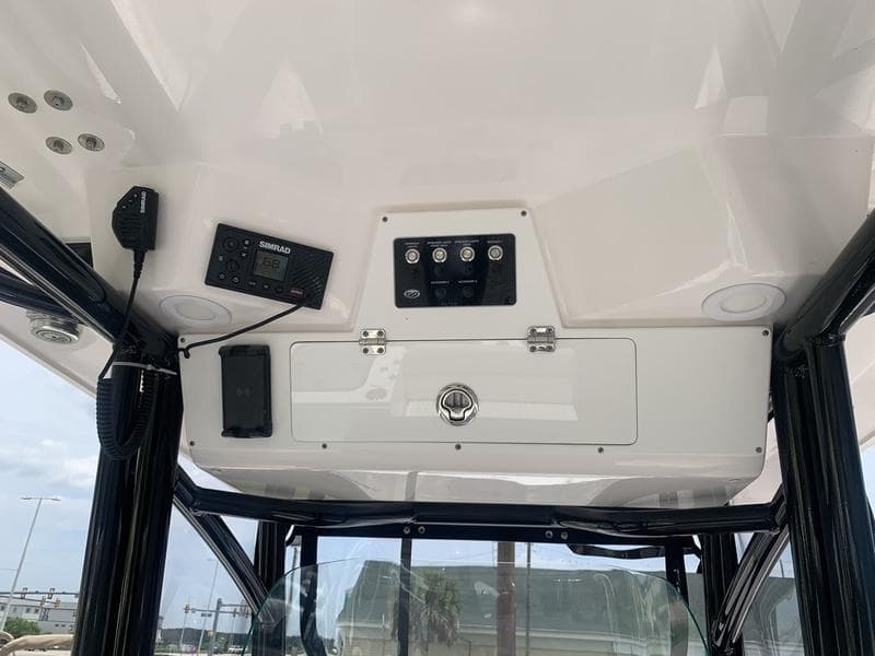 2023 Sea Fox 268 Commander boat console with controls and storage compartment.
