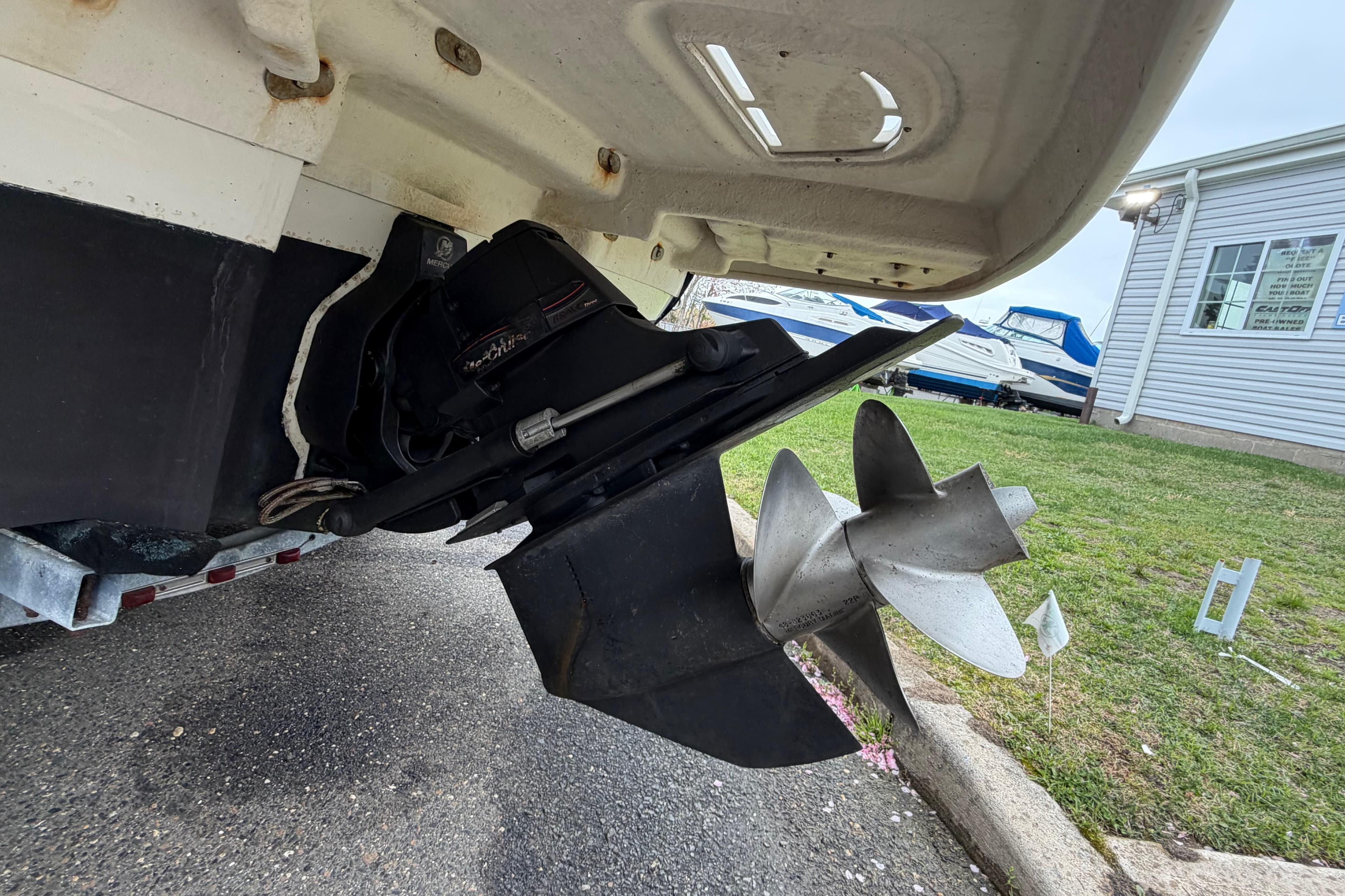 Rear view of a 2009 Sea Ray 210 Sundeck boat propeller and outdrive.