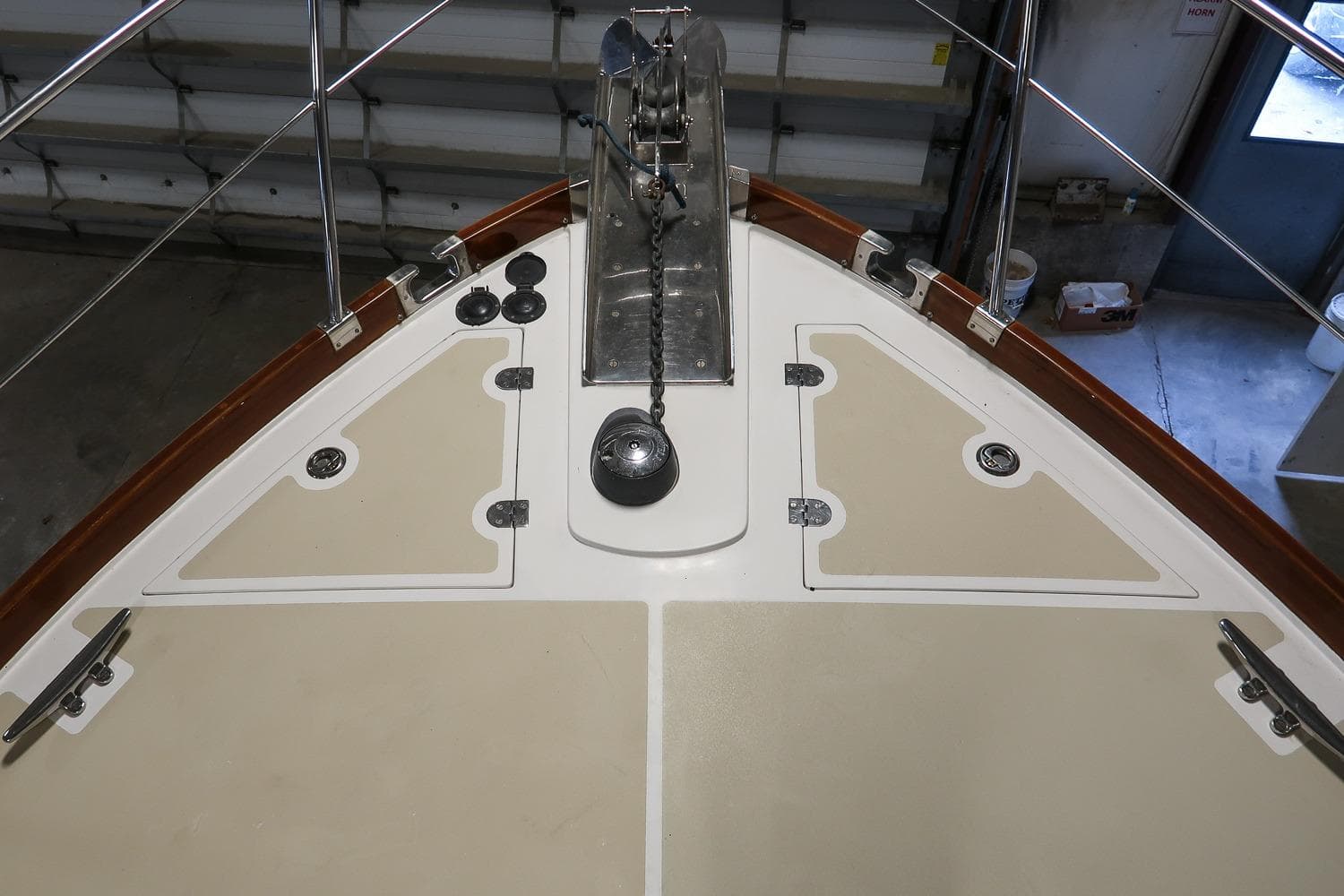 Bow view of 2007 Grand Banks 39 Eastbay SX yacht in a garage setting.