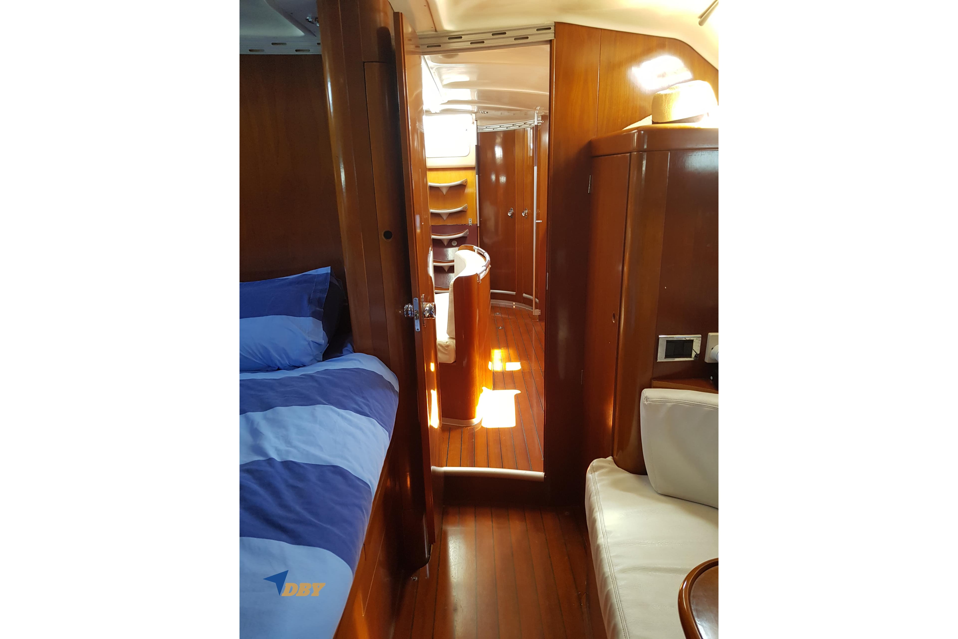 Interior of 1993 Beneteau First 45f5 yacht with wooden finish and cozy cabin.