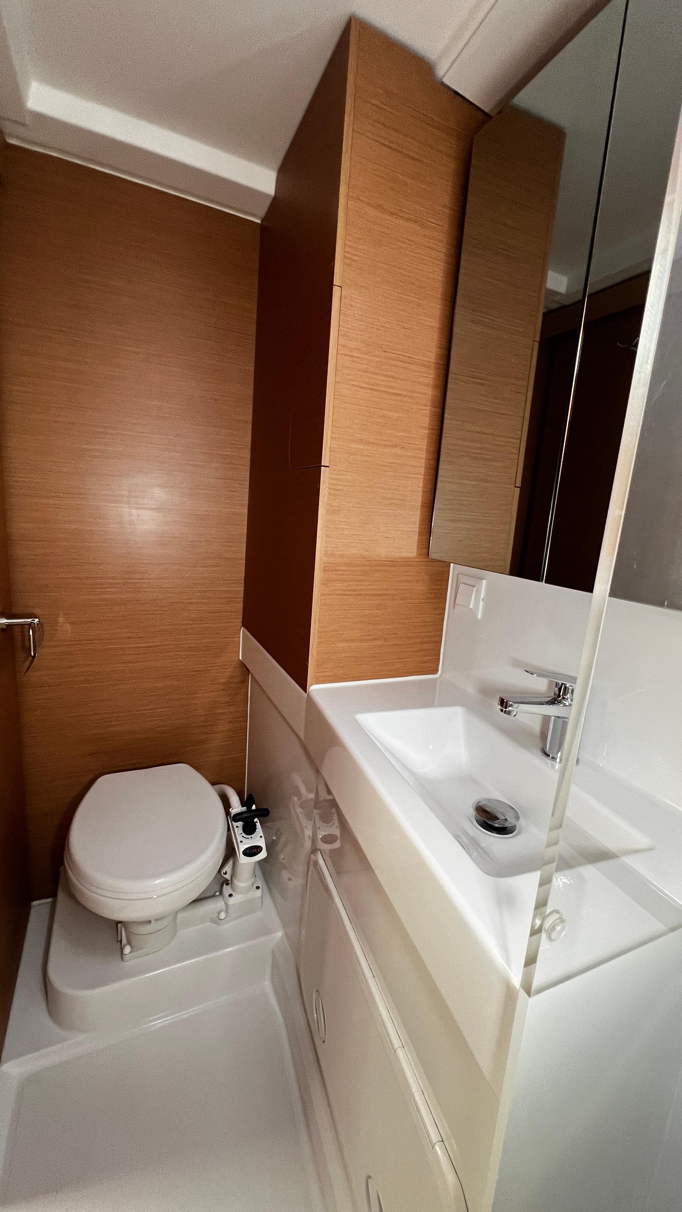 Modern bathroom in 2023 Excess 11 yacht with sleek sink and compact toilet.