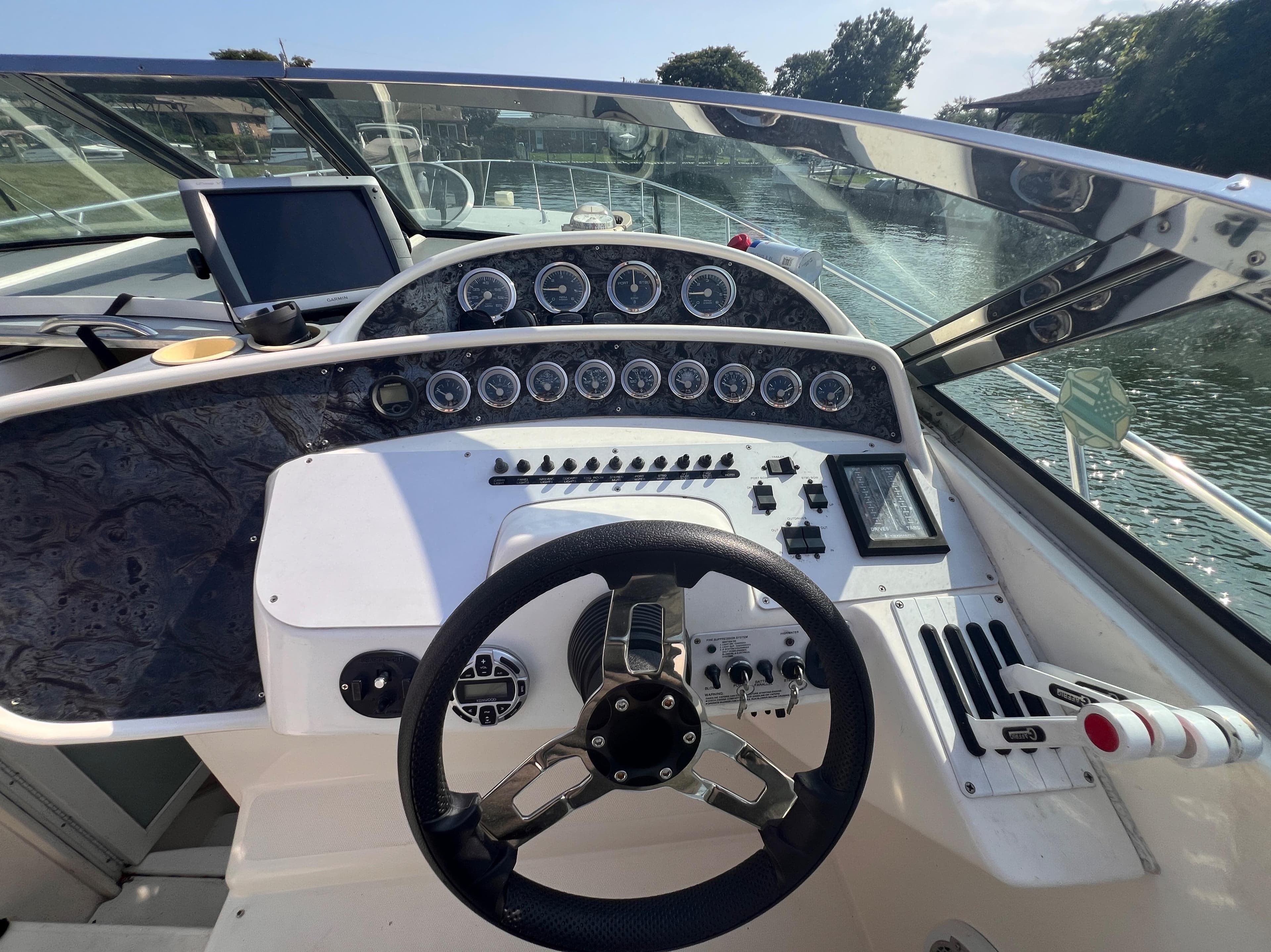 Cockpit of 2000 Wellcraft 45 Excalibur boat with steering wheel and instrument panel.