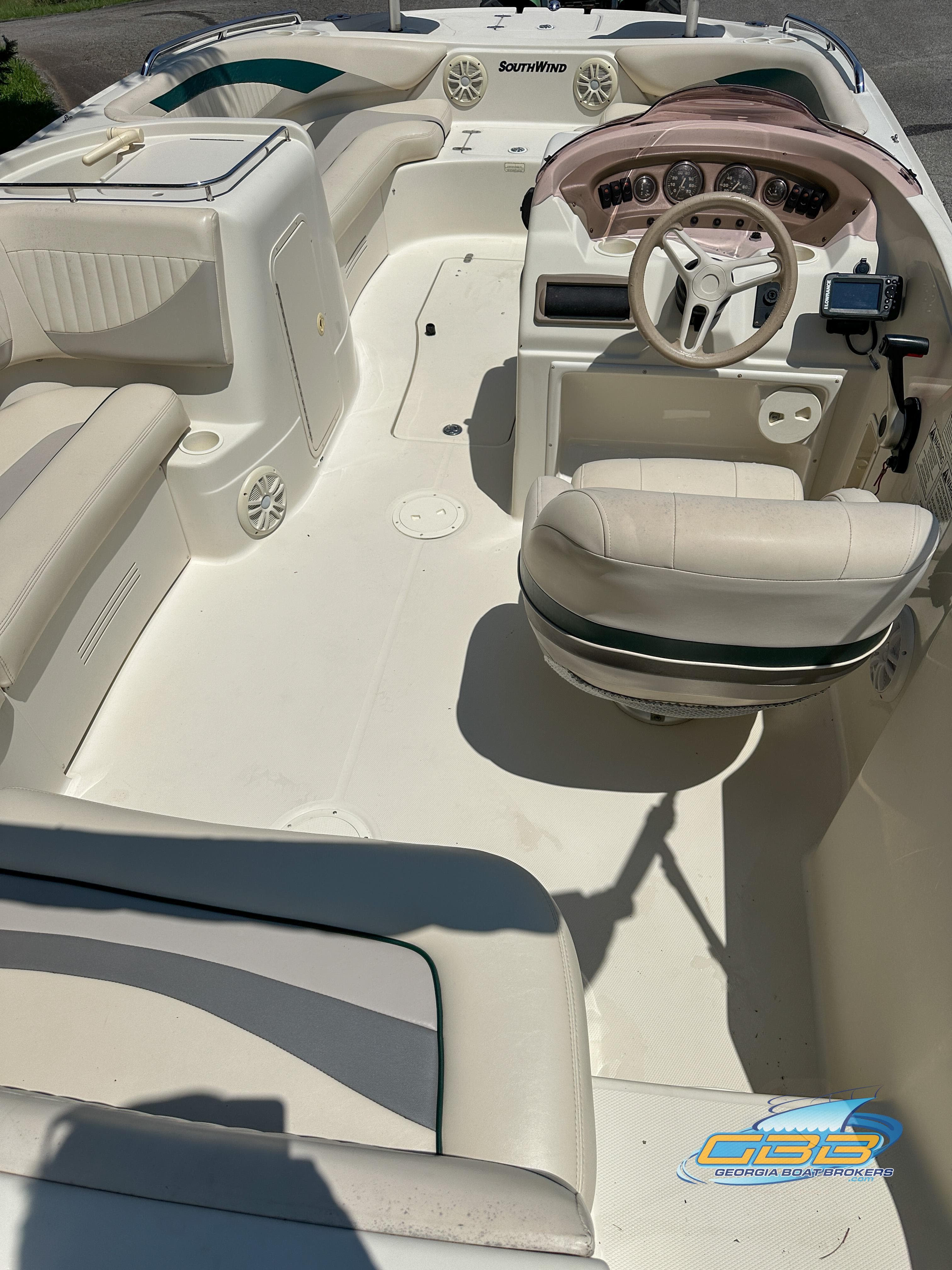 2007 SouthWind 210 SD boat interior with white seating and steering console.